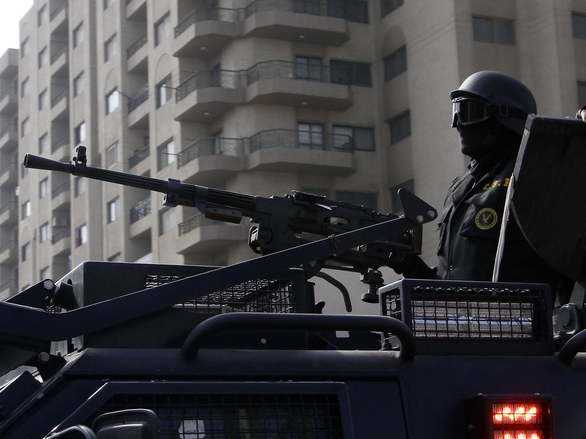 File: Egyptian security forces deployed in the Cairo suburb of Matariyah, Egypt, Sunday, Jan. 25, 2015