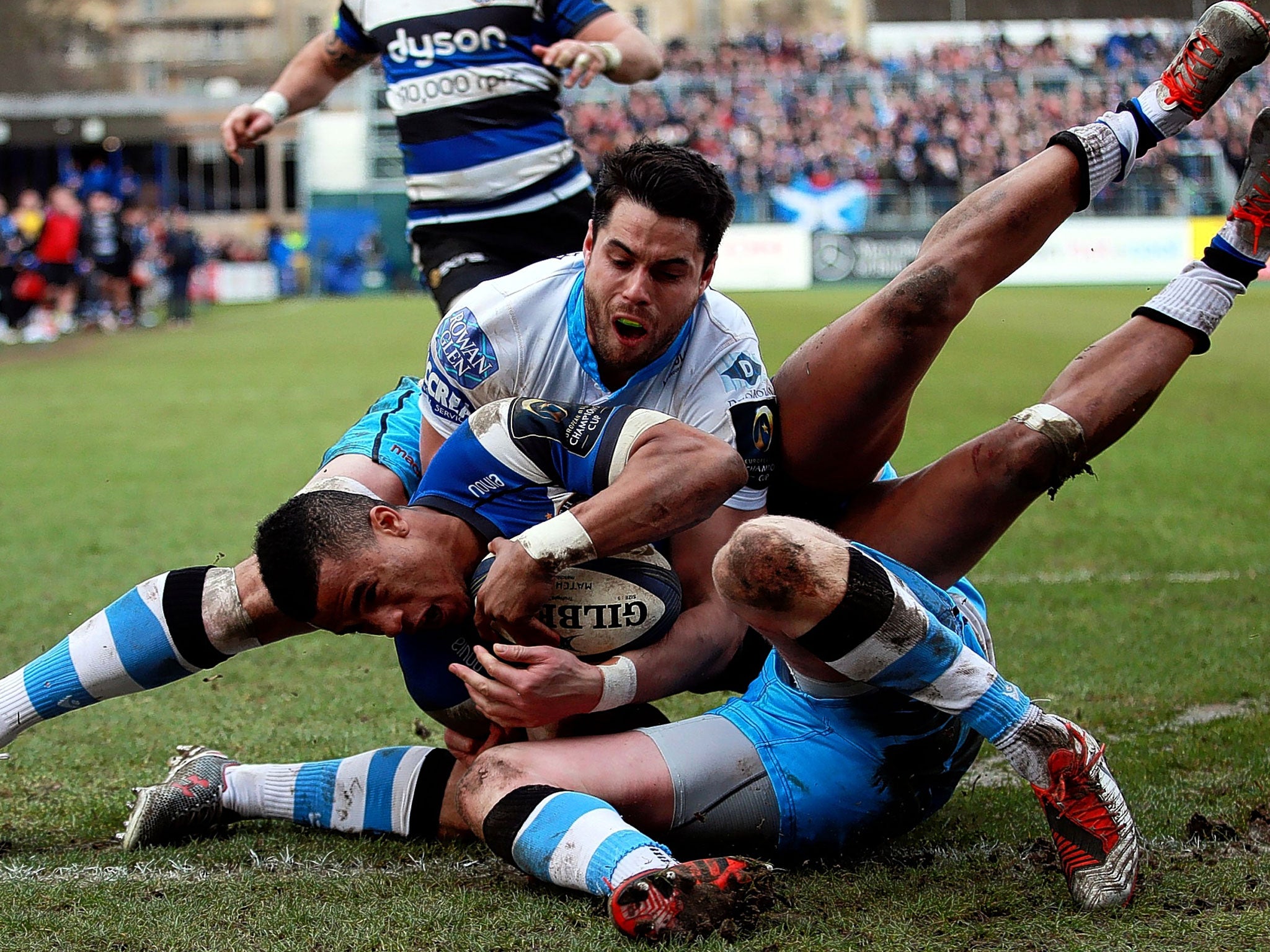 Bath’s Anthony Watson is denied a try by Finn Russell and Sean Maitland