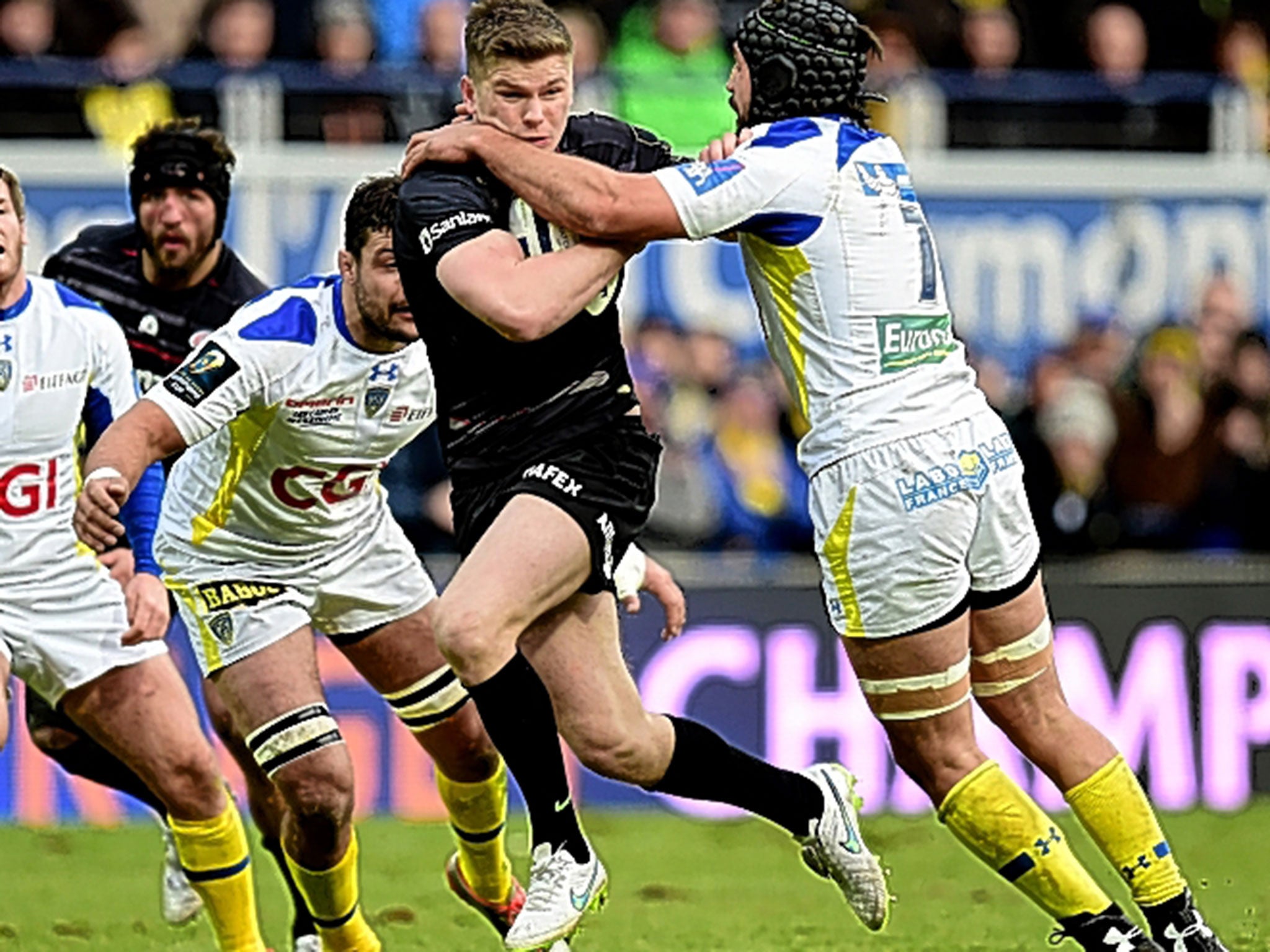 Owen Farrell, of Saracens, who later went off with a leg injury, is tackled by Clermont’s Julien Bardy at Stade Marcel Michelin