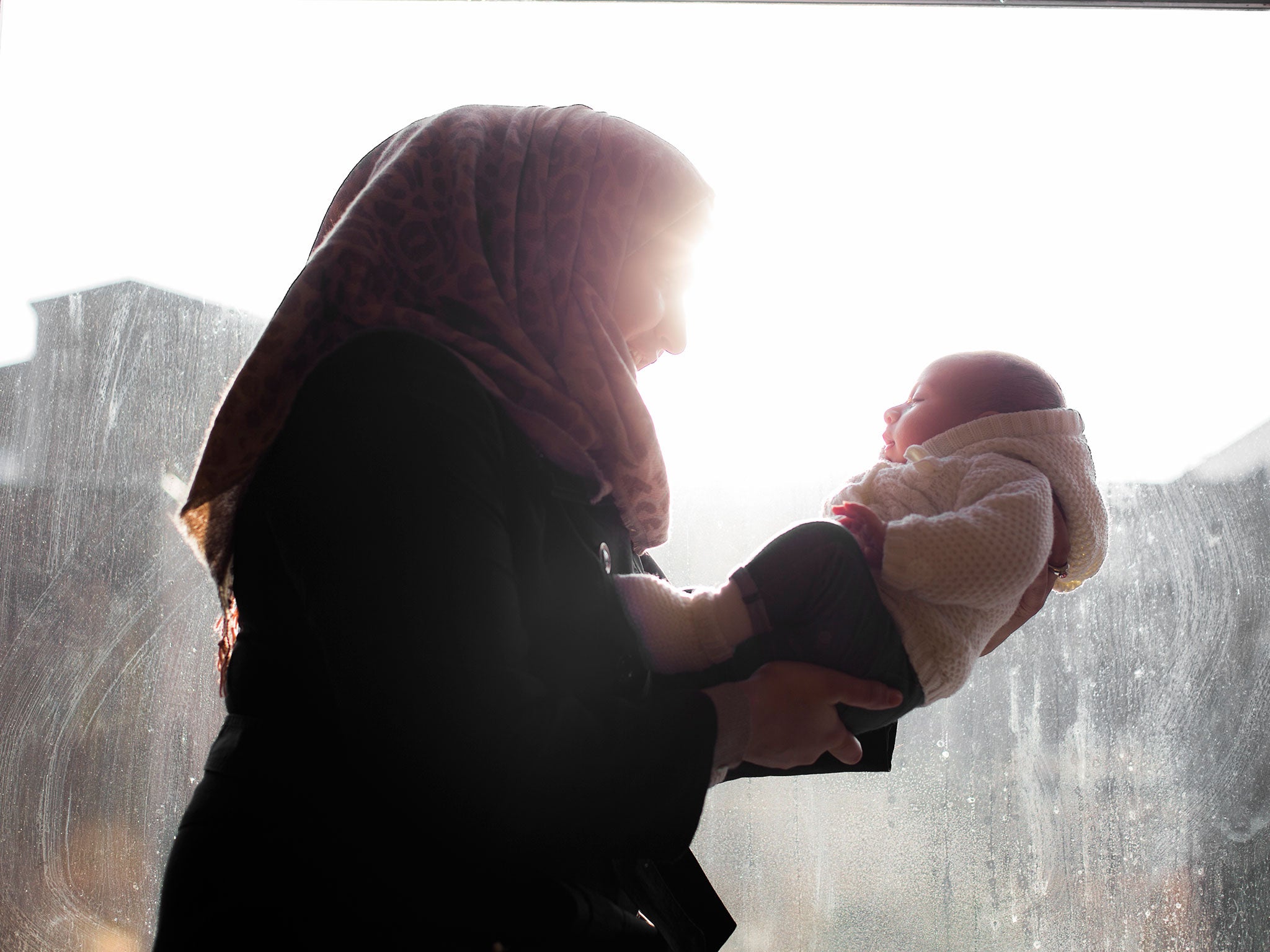 Syrian refugee 'Nour' with her two month-old daughter. She was one of the first Syrians to come to the UK when the Government agreed to resettle 100 people from the country