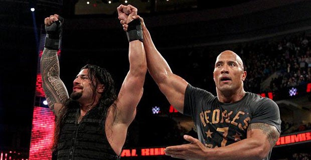 Roman Reigns celebrates with The Rock after winning the Royal Rumble