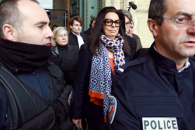 Francoise Bettencourt Meyers (C), daughter of France's richest woman, L'Oreal heiress Liliane Bettencourt, leaves a criminal court in Bordeaux on the first day of the trial of ten people close to Bettencourt