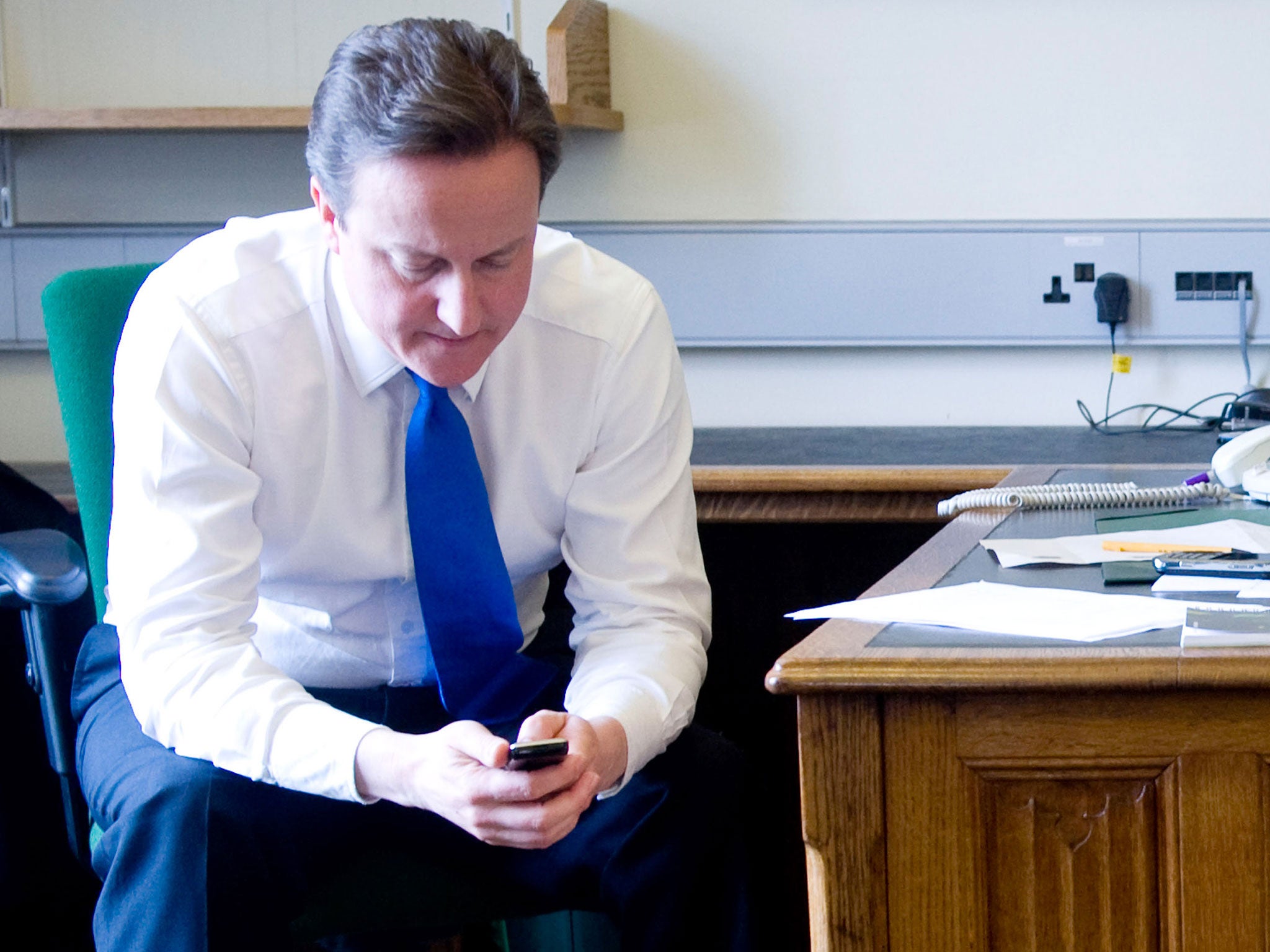 David Cameron on his mobile phone.
