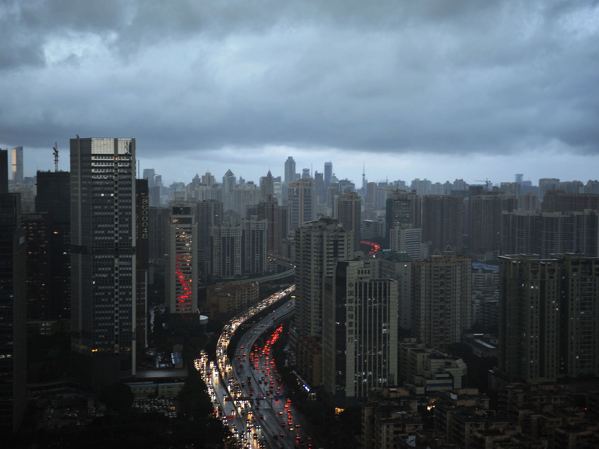 Guangzhou, Guangdong Province of China, where a motorway was built around an apartment complex.