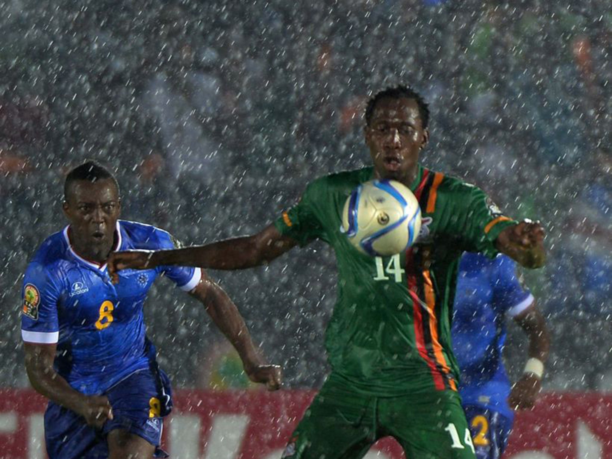 Zambia (in green) and Cape Verde were both knocked out after a 0-0 draw in a heavy rain storm in Ebebiyin on Monday