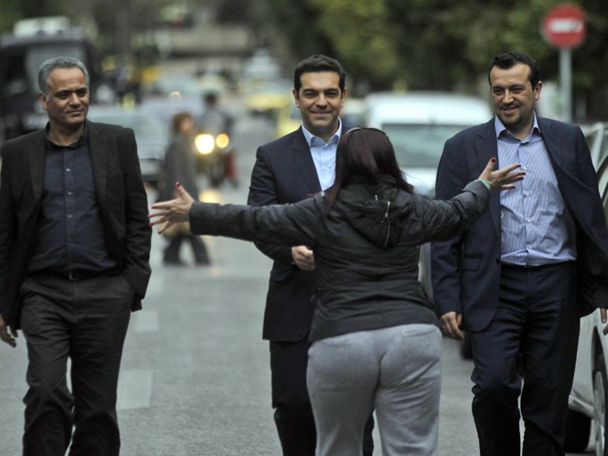 A voter greets new Greek PM Alexis Tsipras in the street following his election victory (EPA)