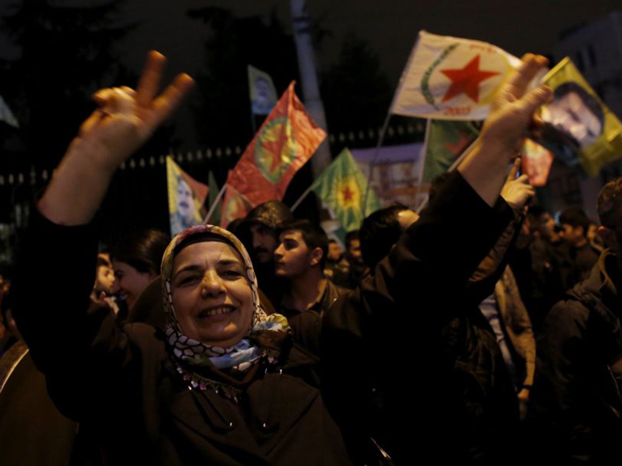 Pro-Kurdish demonstrators celebrate in central Istanbul, after Kurdish forces took full control of the Syrian town of Kobani (Reuters)