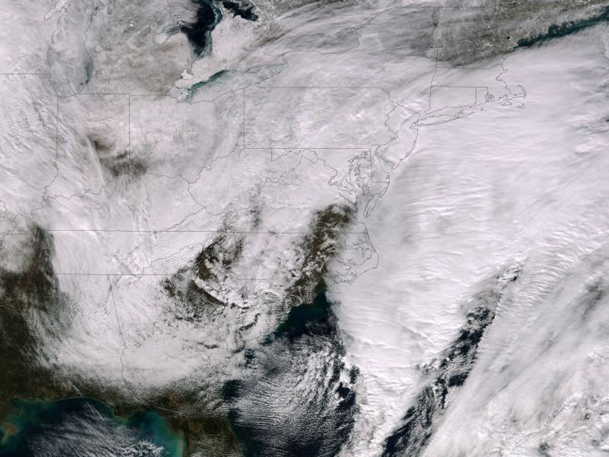 A satellite photograph shows a major winter storm bringing snow to the Northeast of the US