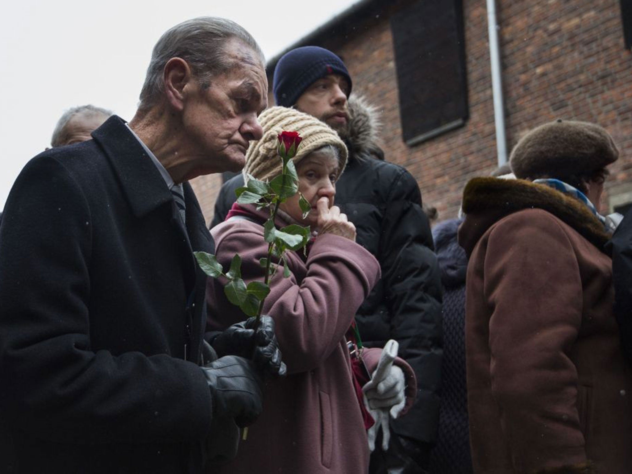 Holocaust survivors pay tribute to fallen comrades at the "death wall" of Auschwitz