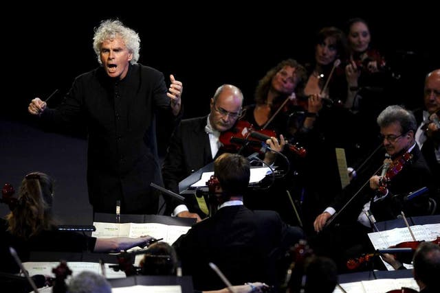 Baton charge: Simon Rattle conducting the LSO in 2012 