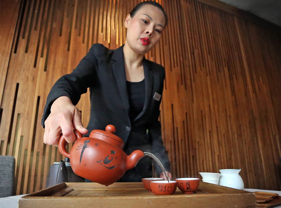 Carmen Khu from The Royal China Club pours a cup of Dai-Hong-Po tea