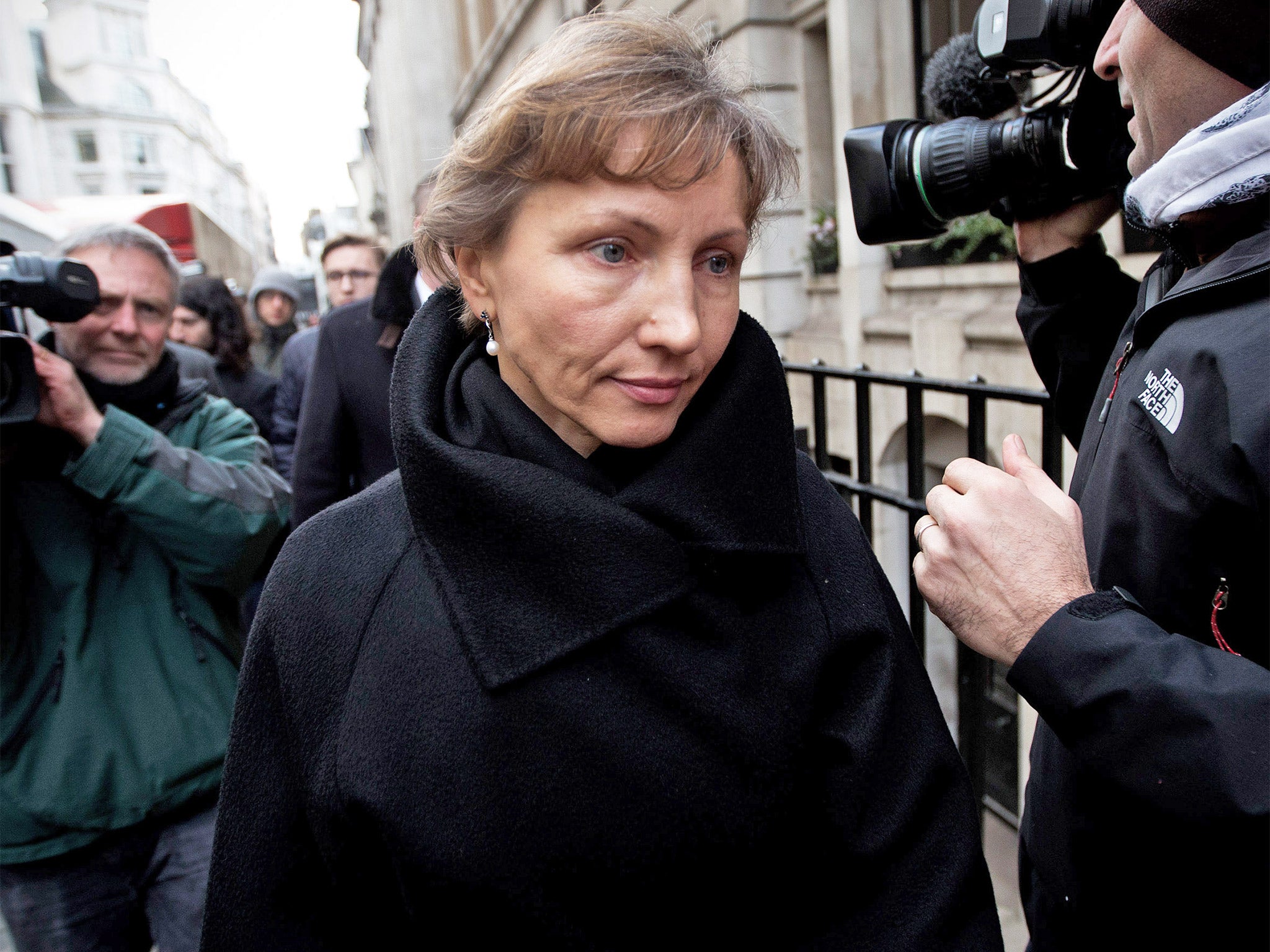 Marina Litvinenko, the widow of former KGB agent Alexander Litvinenko, leaves the High Court after the opening of the inquiry into his death