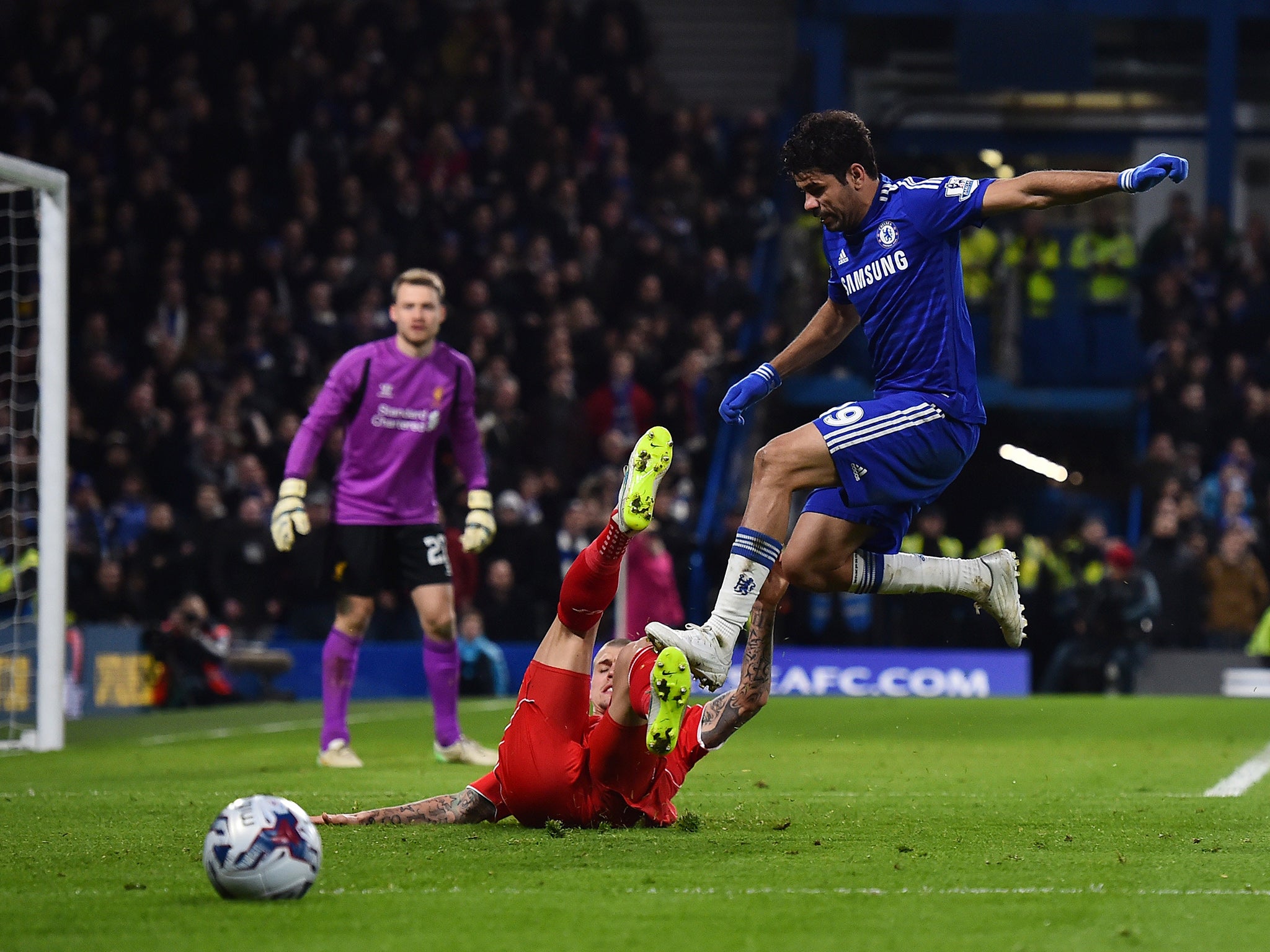 Chelsea striker Diego Costa clashes with Liverpool's Martin Skrtel at Stamford Bridge