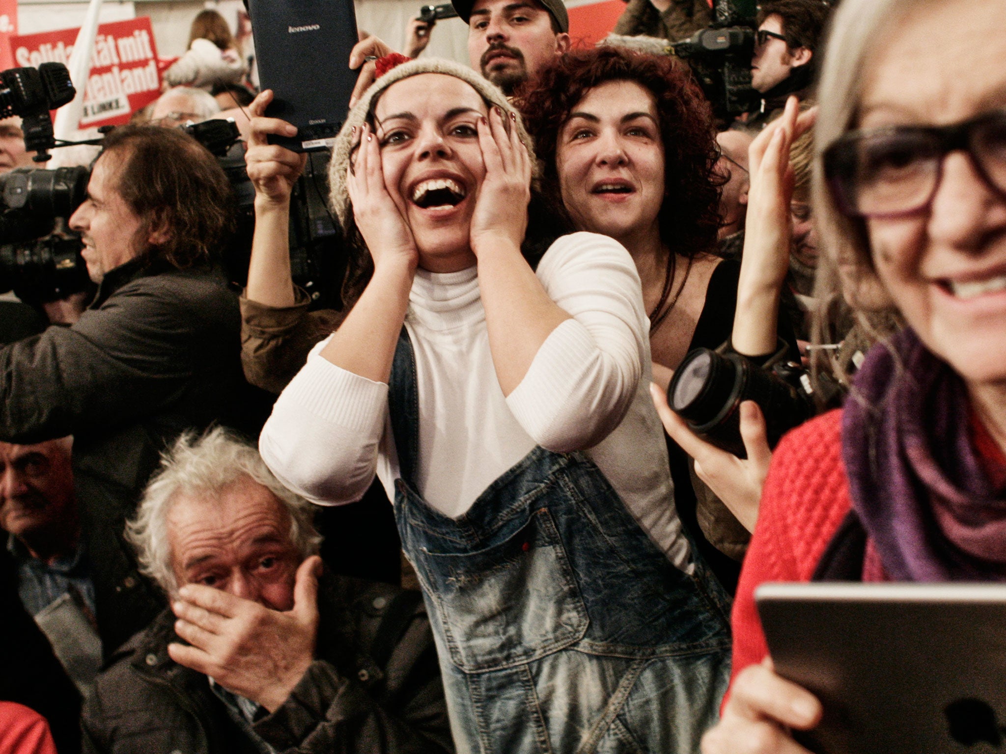 Supporters of the opposition radical leftist Syriza party celebrate their election victory