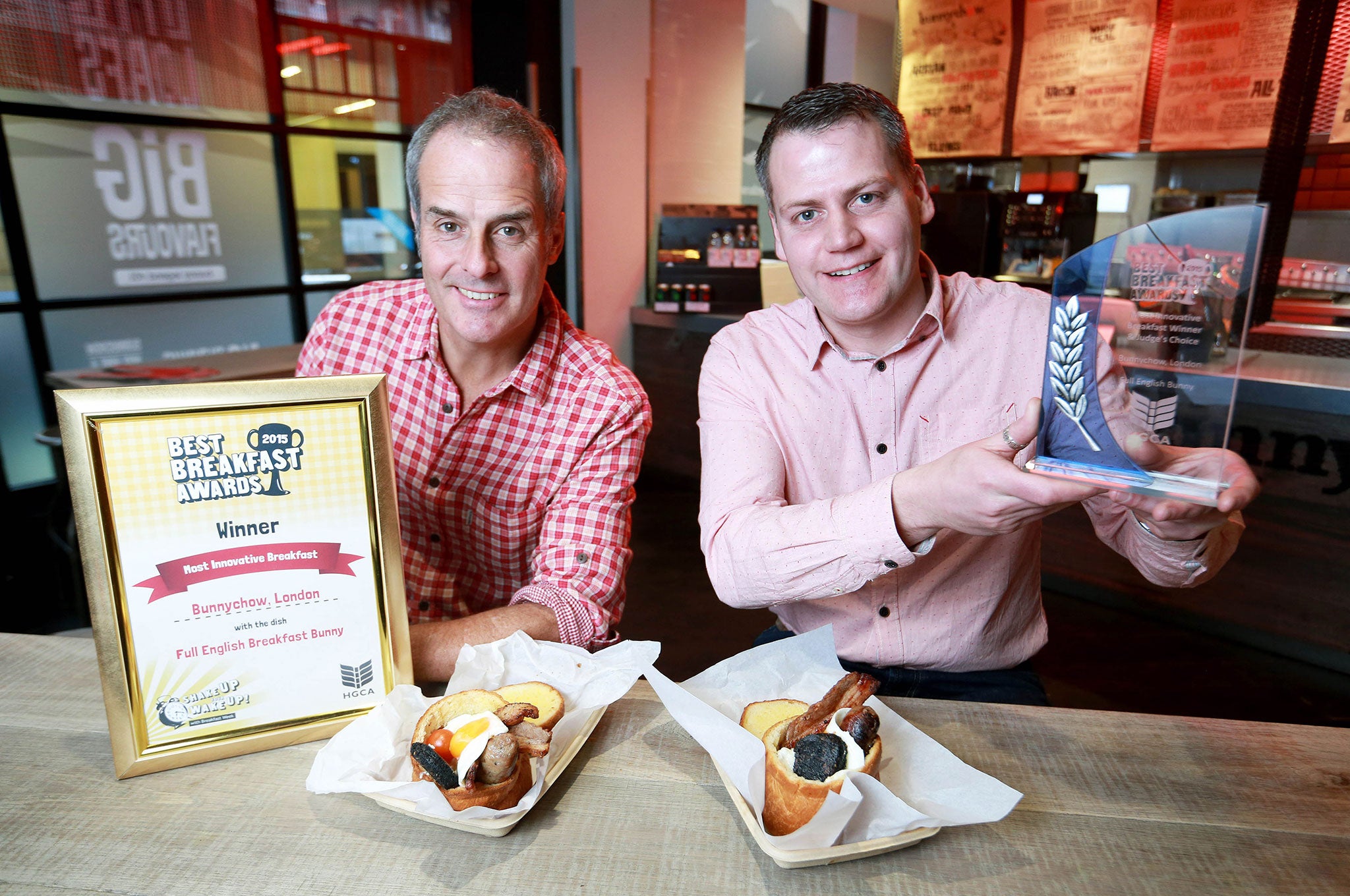 Television chef Phil Vickery presents the 2015 Best Breakfast Award for the UK's Most Innovative Breakfast to Atholl Milton CEO of Bunnychow, for the Full English Bunny