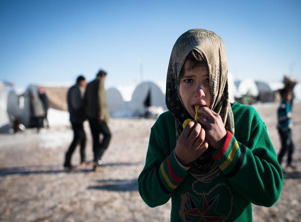 A young Syrian refugee in a makeshift camp