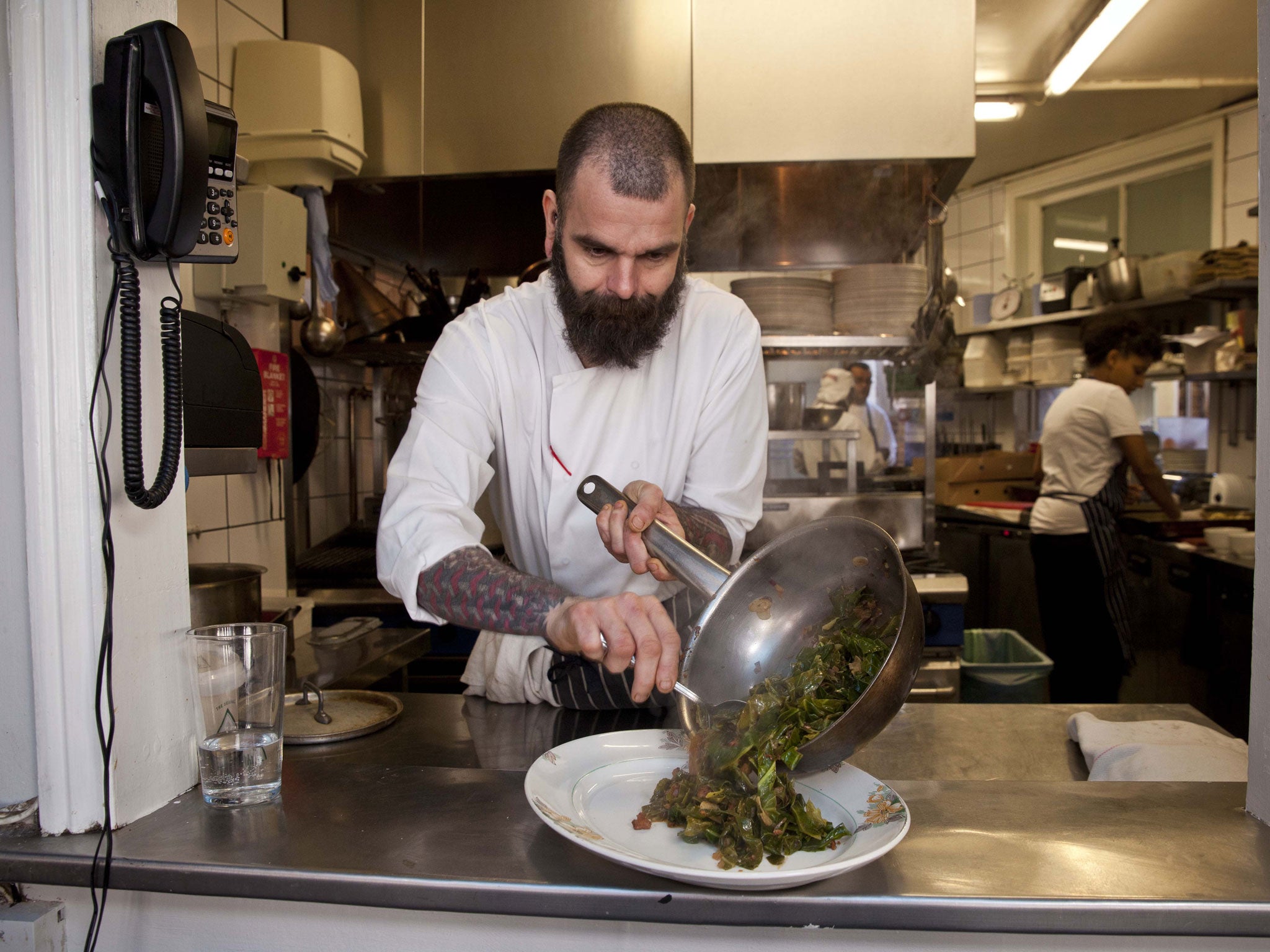 Chef Benoit Berringer cooking with cabbages