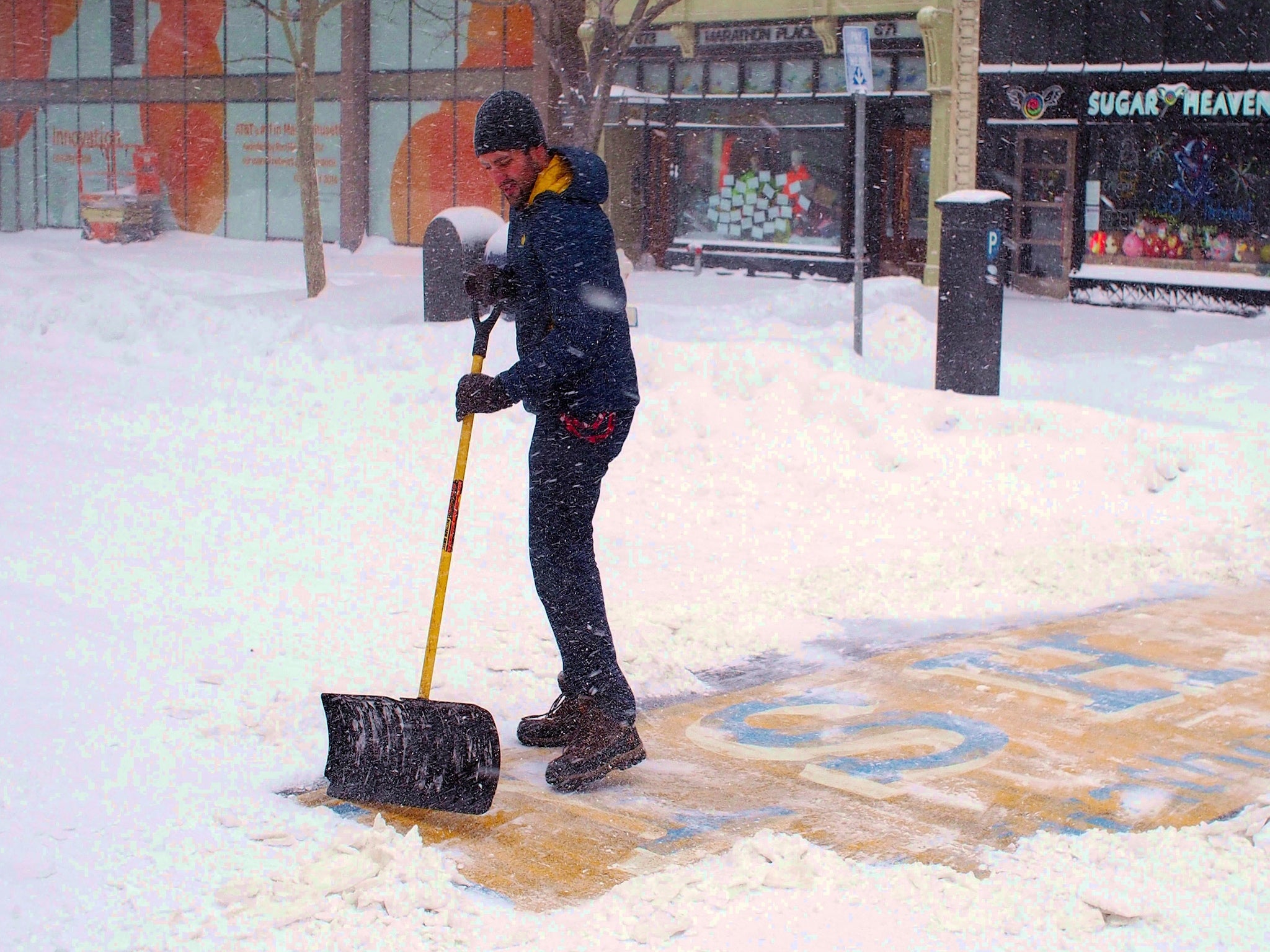 Chris Laudani cleared snow from the finishing line of the Boston Marathon