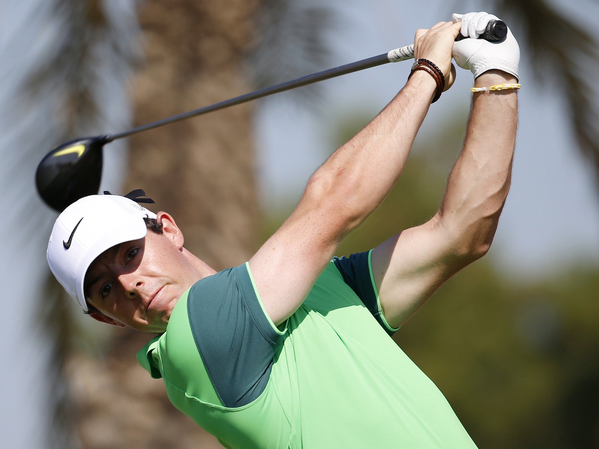 Rory McIlroy hit a first-round score of 66, two off the lead, in the Dubai Desert Classic at the Emirates Golf Club yesterday