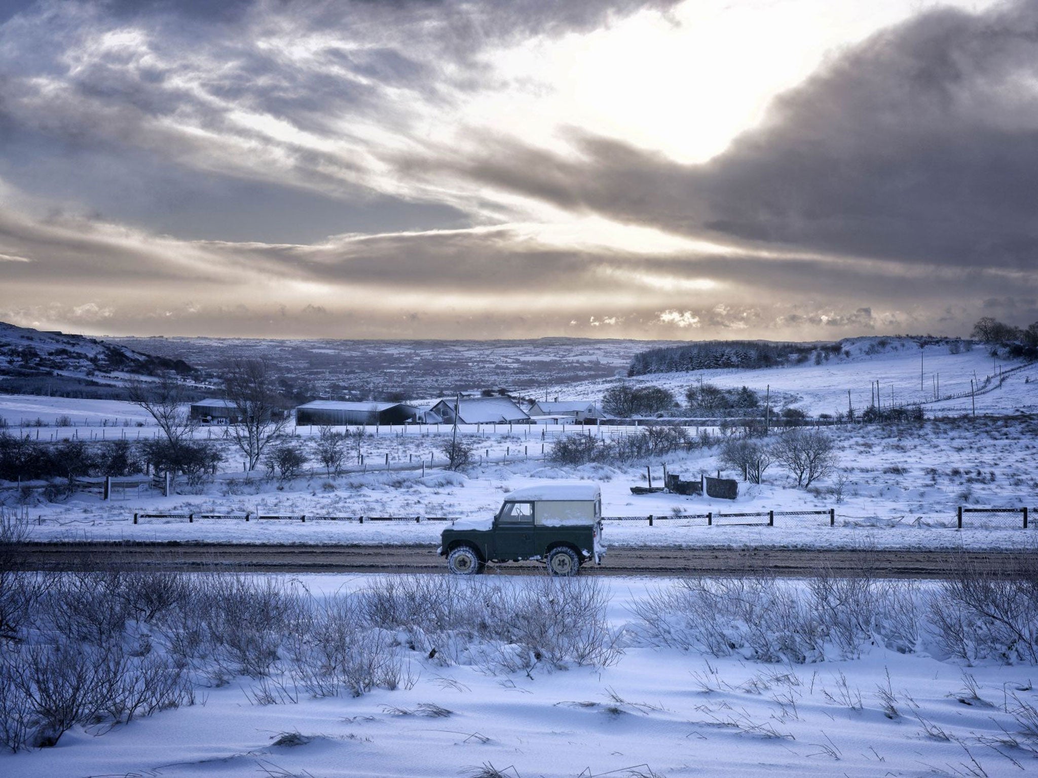 Motorists make their way over Hannahstown Hill, near Belfast