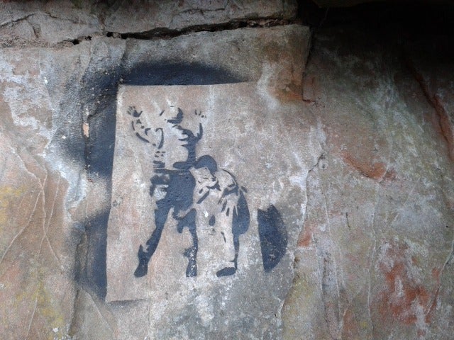 Fake Banksy stencils on Lacy Caves