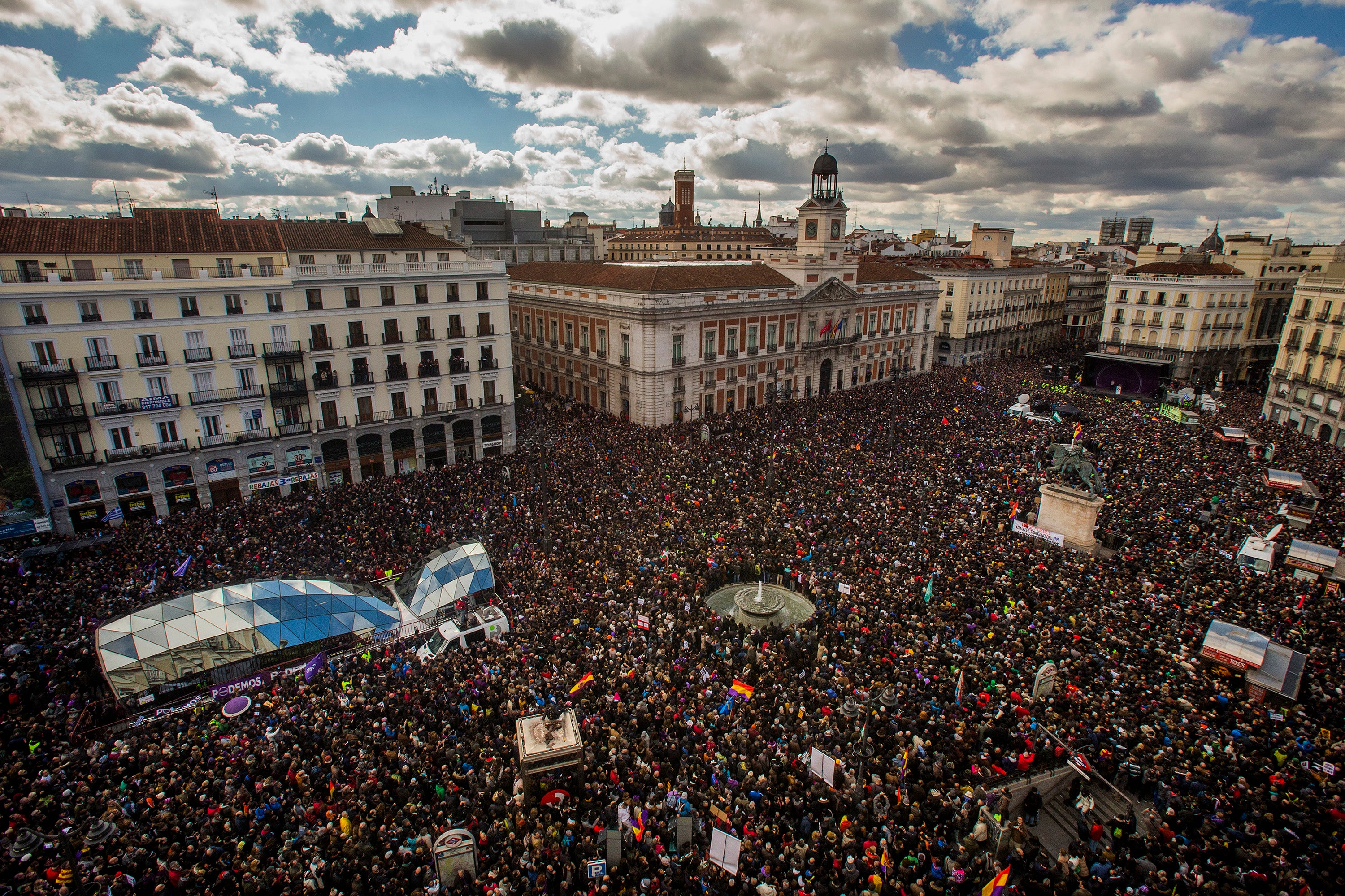 People gather in the main square of Madrid during a Podemos (We Can) party march in Madrid
