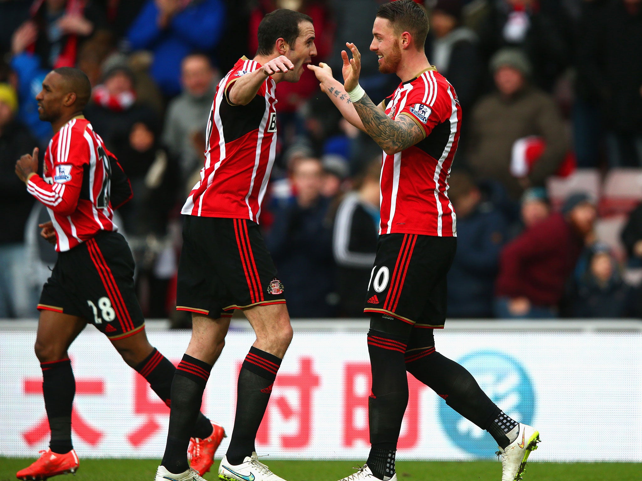 John O'Shea celebrates with Connor Wickham after the latter scores the opener