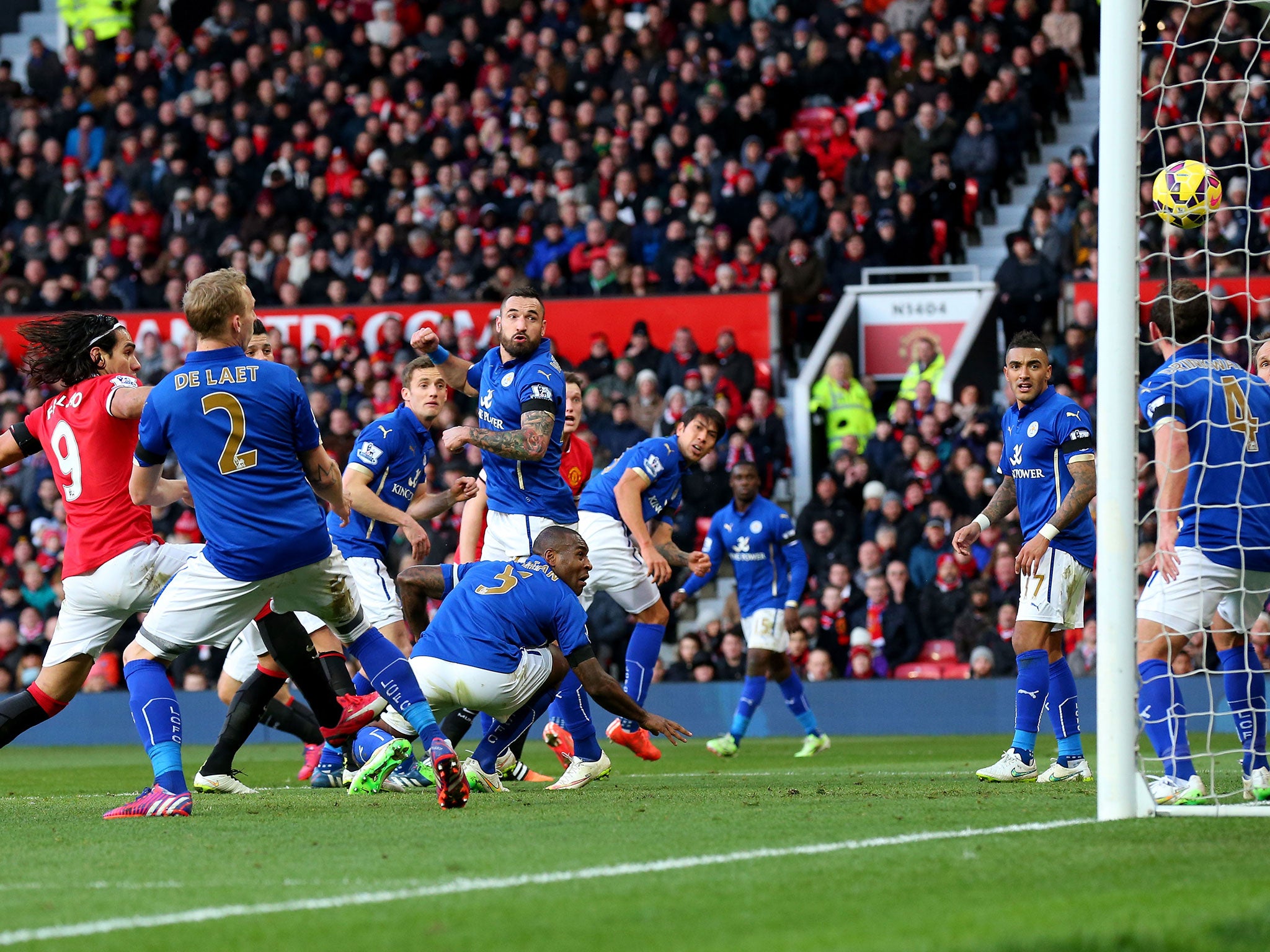 Wes Morgan heads into his own net for United's third goal