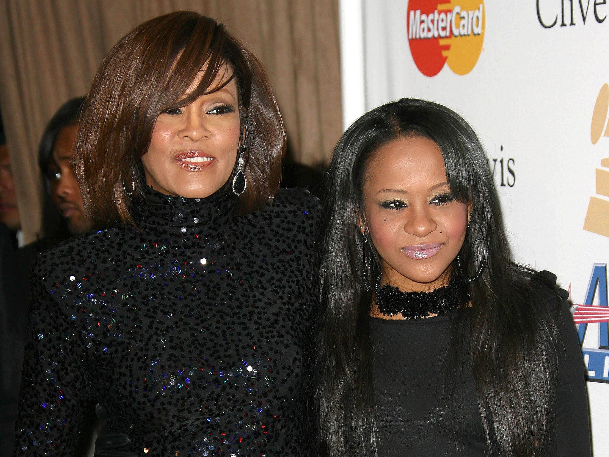 Bobbi Kristina Brown with her mother Whitney Houston in 2011