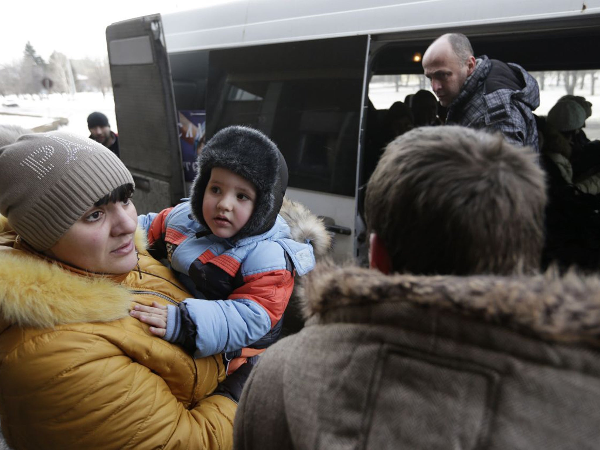 Civilians in Debaltseve board an evacuation bus on Saturday (AP)