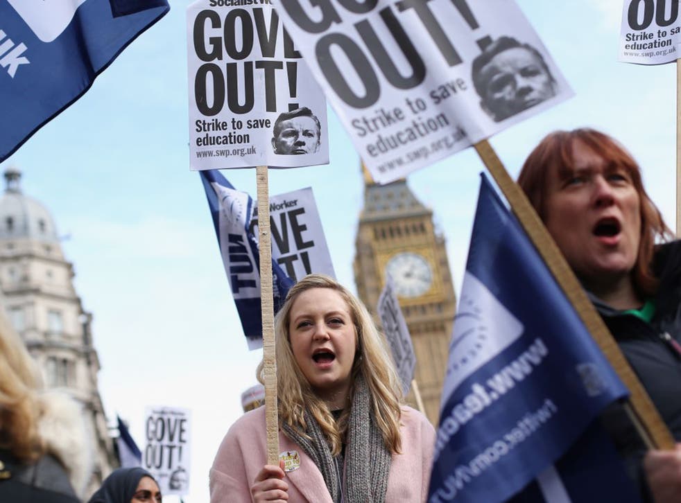 Angry teachers took part in a rally through Westminster in March last year following a one-day walkout (Getty)