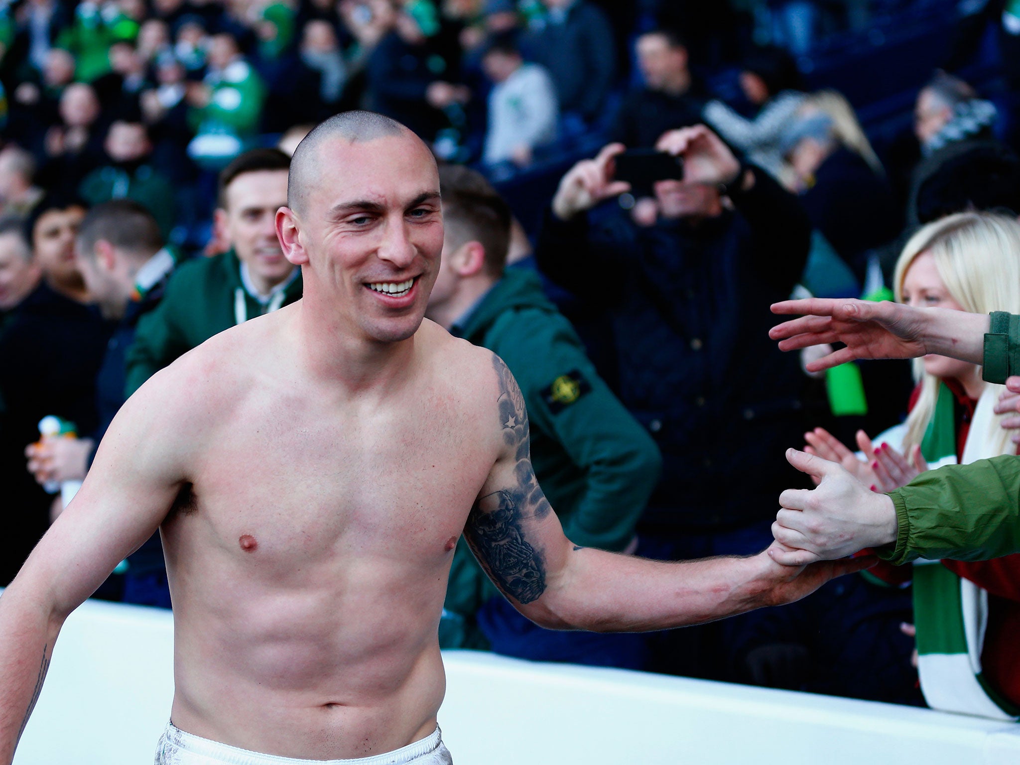 Scott Brown celebrates with fans after win over Rangers