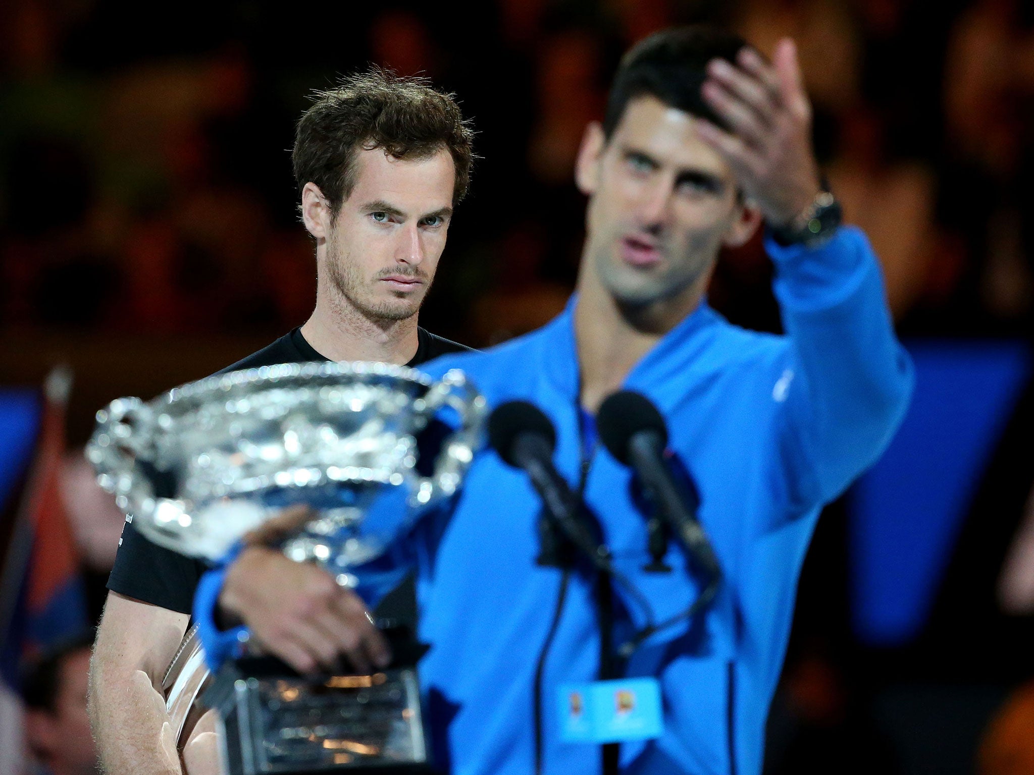 Murray looks on as Djokovic lifts his trophy