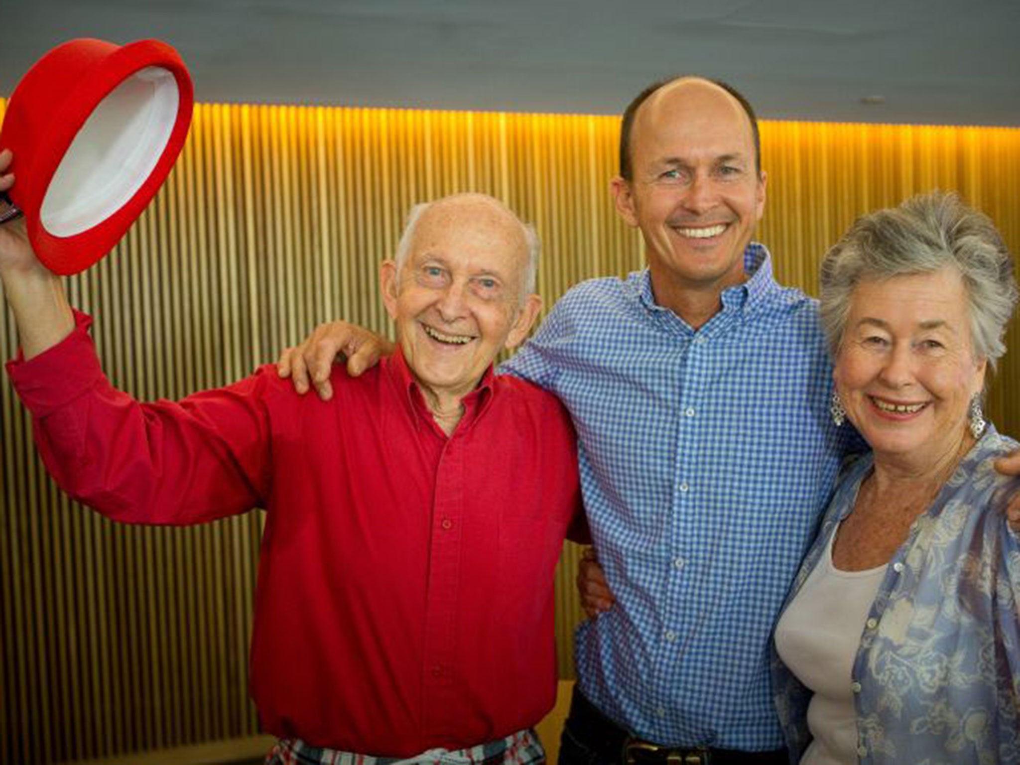 Peter Greste's father Juris (left), brother Andrew (centre) and mother Lois (R) smile after holding a press conference in Brisbane