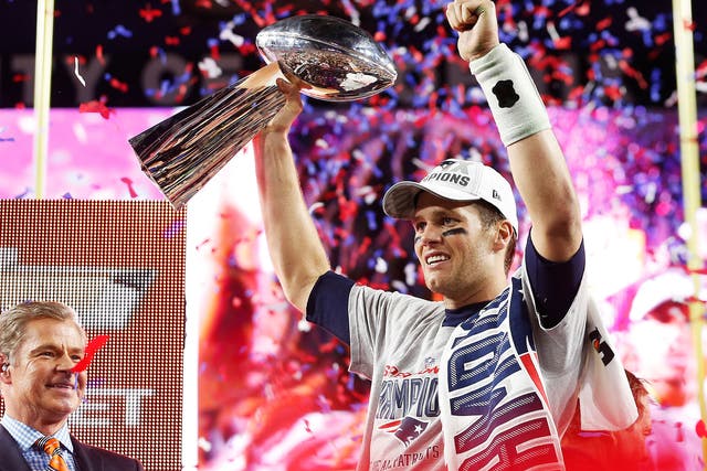 Tom Brady lifts the Super Bowl trophy