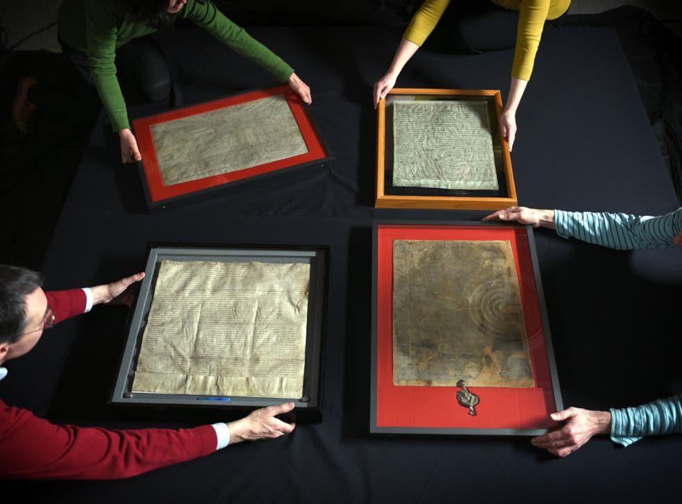The four original surviving copies of the Magna Carta are brought together for the first time, as they are prepared for display at the British Library in central London, as part of its 800th anniversary