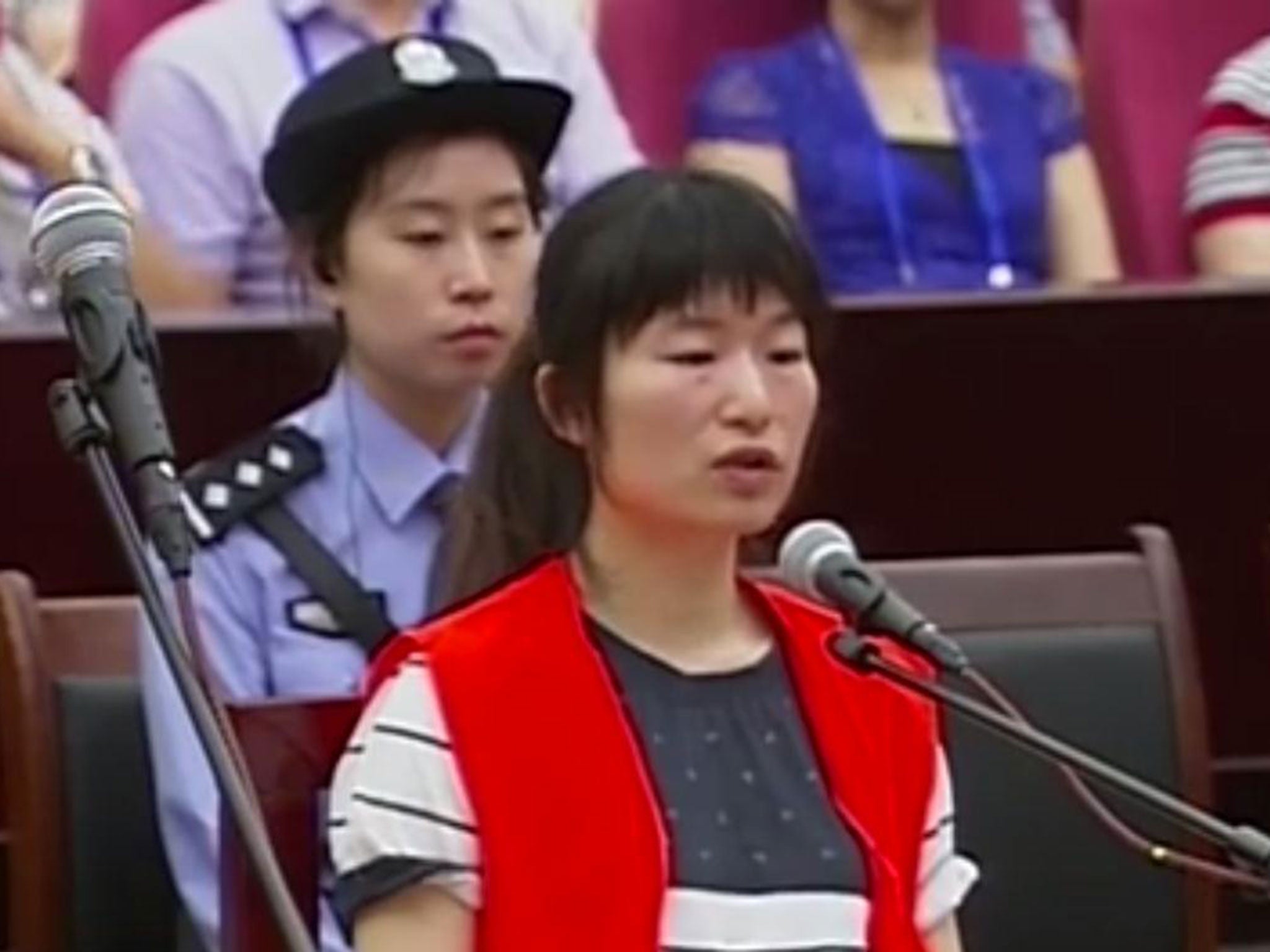 A woman, said to be Church of the Almighty God member Zhang Fan, on trial for murder