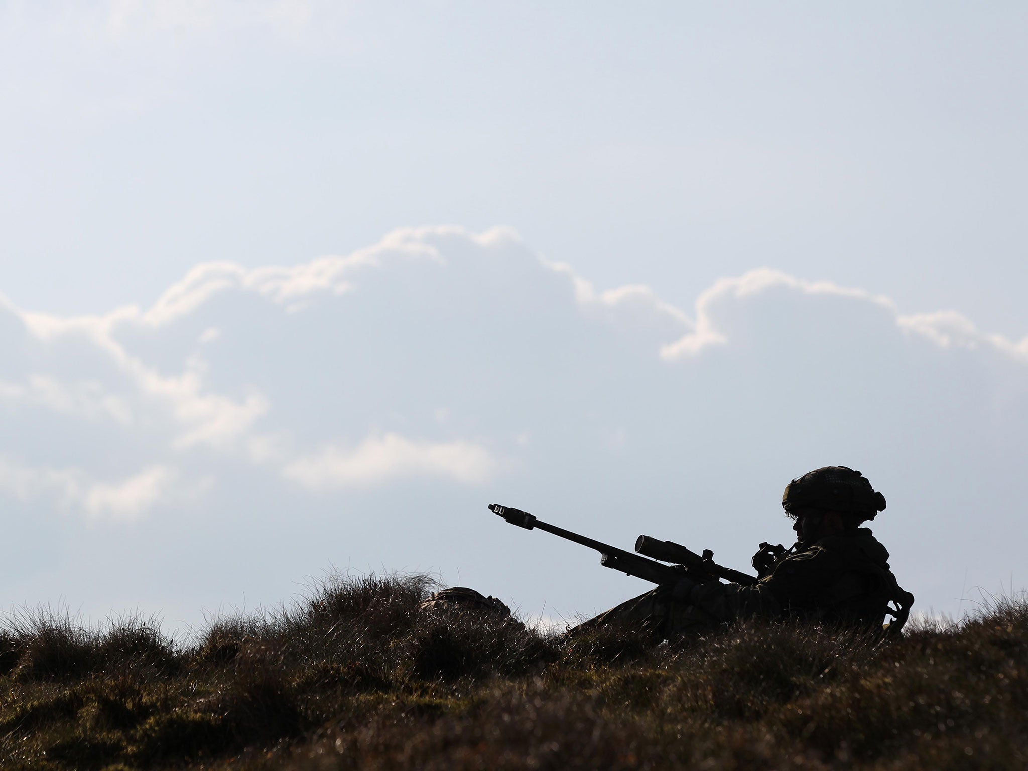 A sniper secures as area during the 16 Air Assault Brigade Exercise Joint Warrior at West Freugh Airfield, Stranraer, Scotland on April 16, 2012.