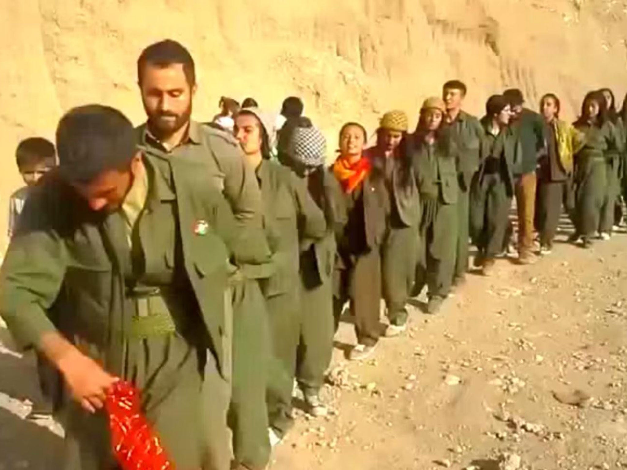 Kurdish fighters dancing through Kobani after driving Isis out of the city