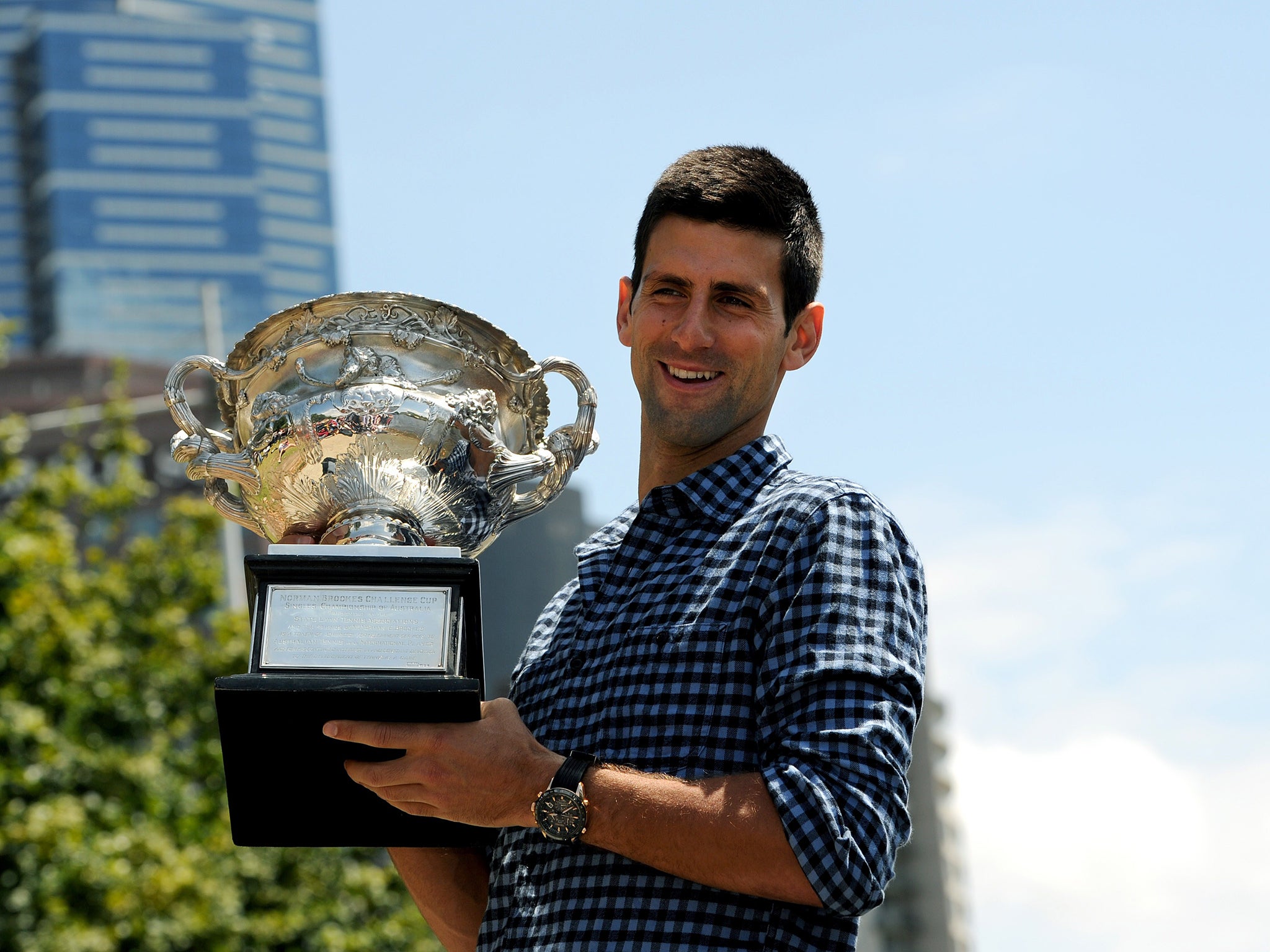 Novak Djokovic with the Australian Open trophy at the Melbourne University Boat Club