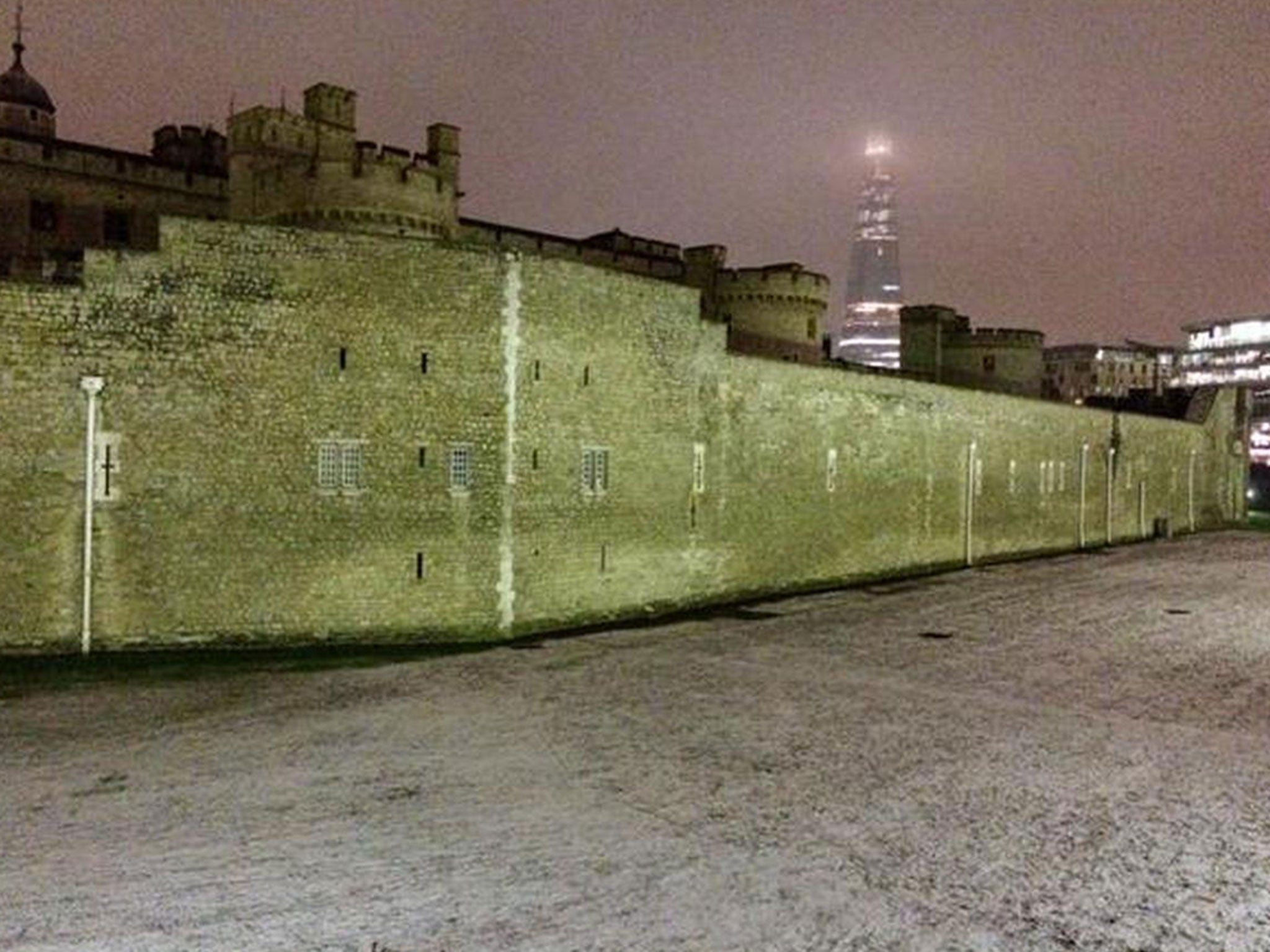 The Shard can be seen behind a snowy Tower of London on Tuesday. Picture: Simon Cardy