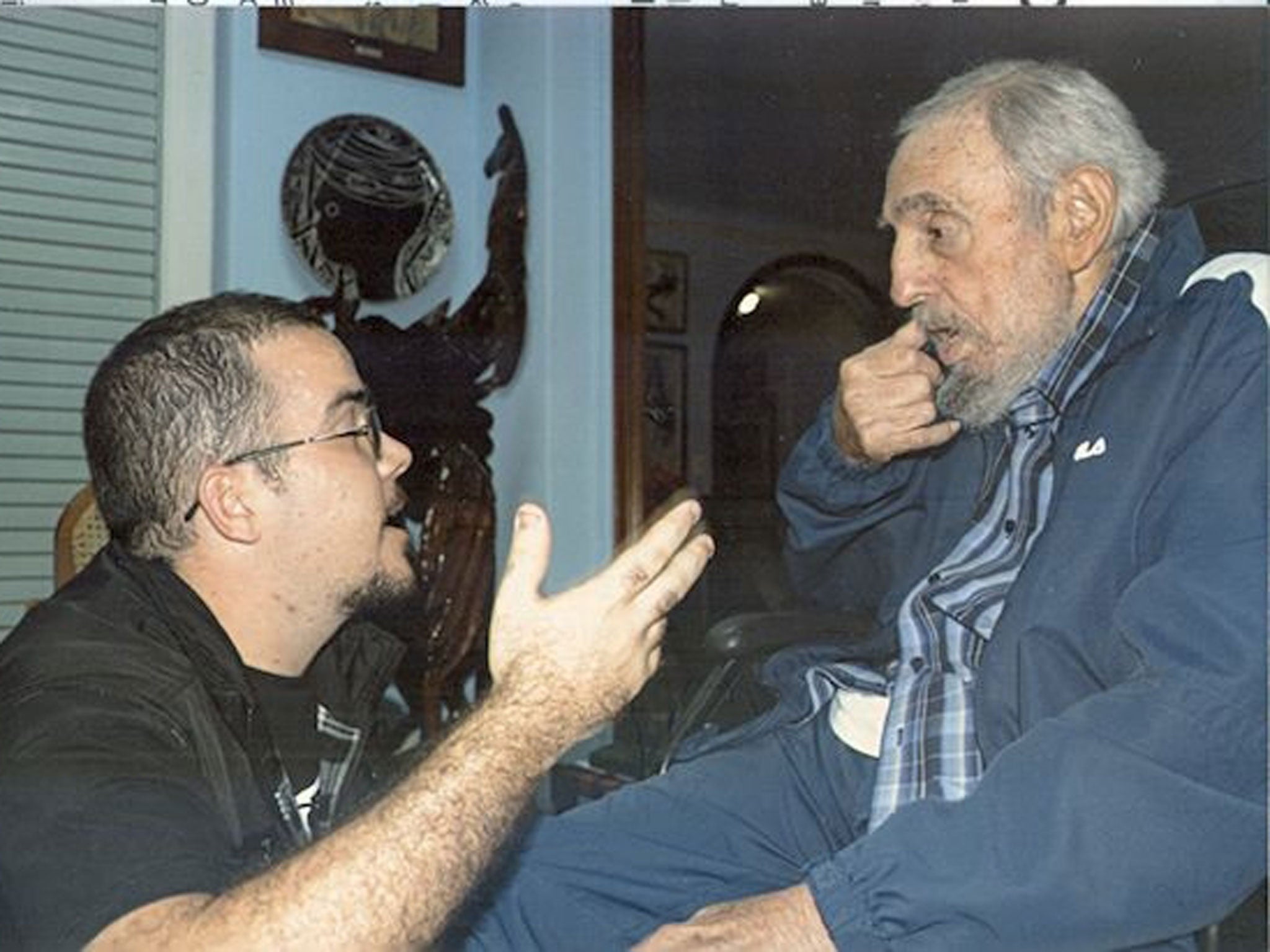 Former Cuban President Fidel Castro talks to President of Cuba's University Students Federation (FEU) Randy Perdomo during a meeting in Havana in this picture provided by Cubadebate. Photographs of Castro, 88, appeared in official media on February 2, 201