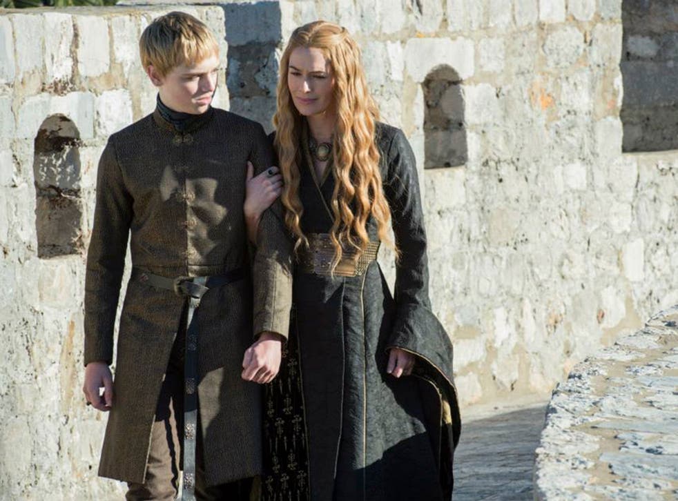 Dean-Charles Chapman as Tommen Baratheon and Lena Headey as Cersei Lannister in Game of Thrones
