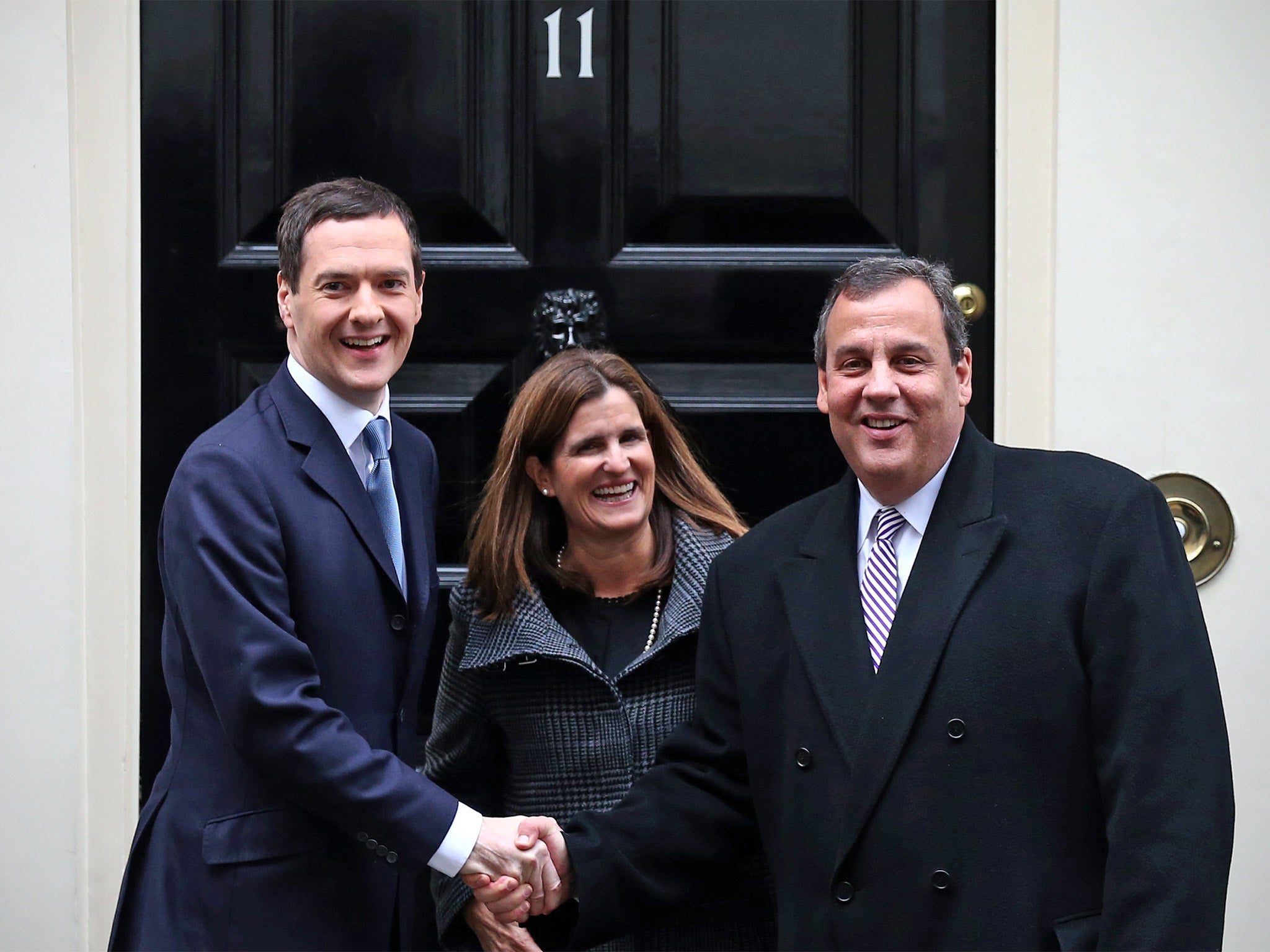 Chris Christie and his wife Mary Pat are greeted by Chancellor George Osborne in Downing Street on Tuesday