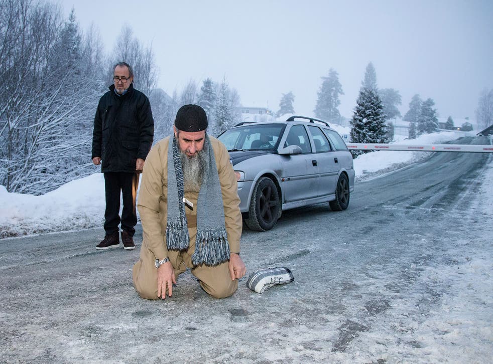 Iraqi-born cleric Mullah Krekar, kneels to pray, after being released from Kongsvinger prison, in Kongsvinger, Norway
