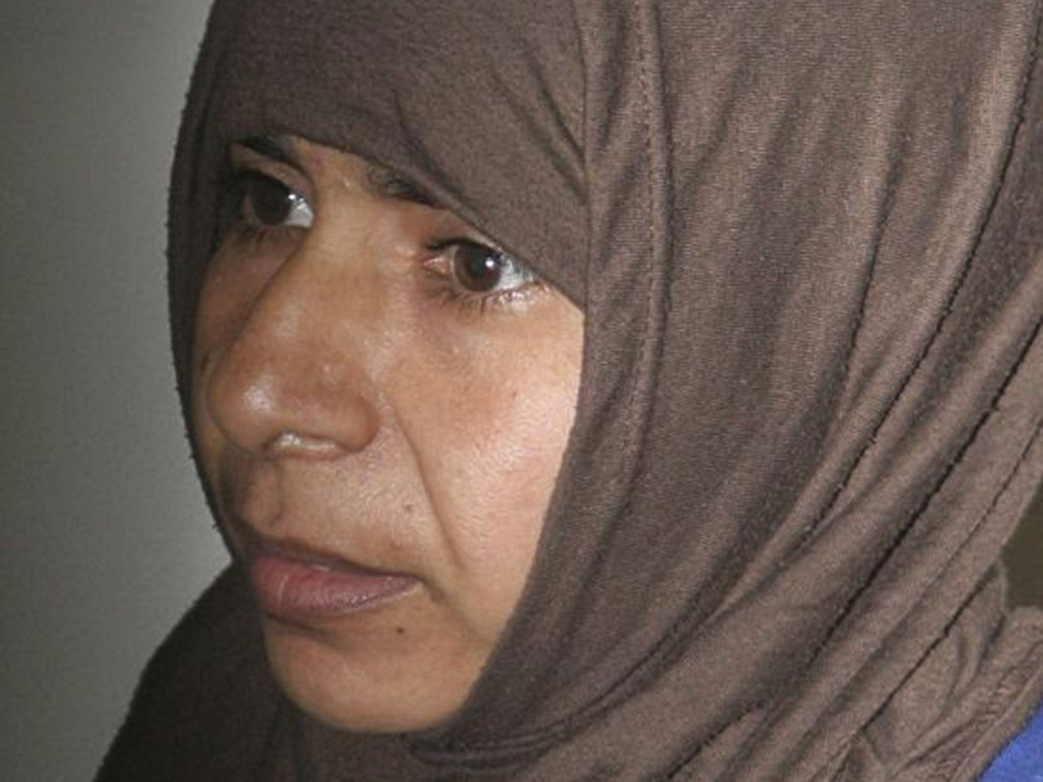 Iraqi Sajida al-Rishawi, 35, stands inside a military court at Juwaida prison in Amman in this April 24, 2006 file photo.