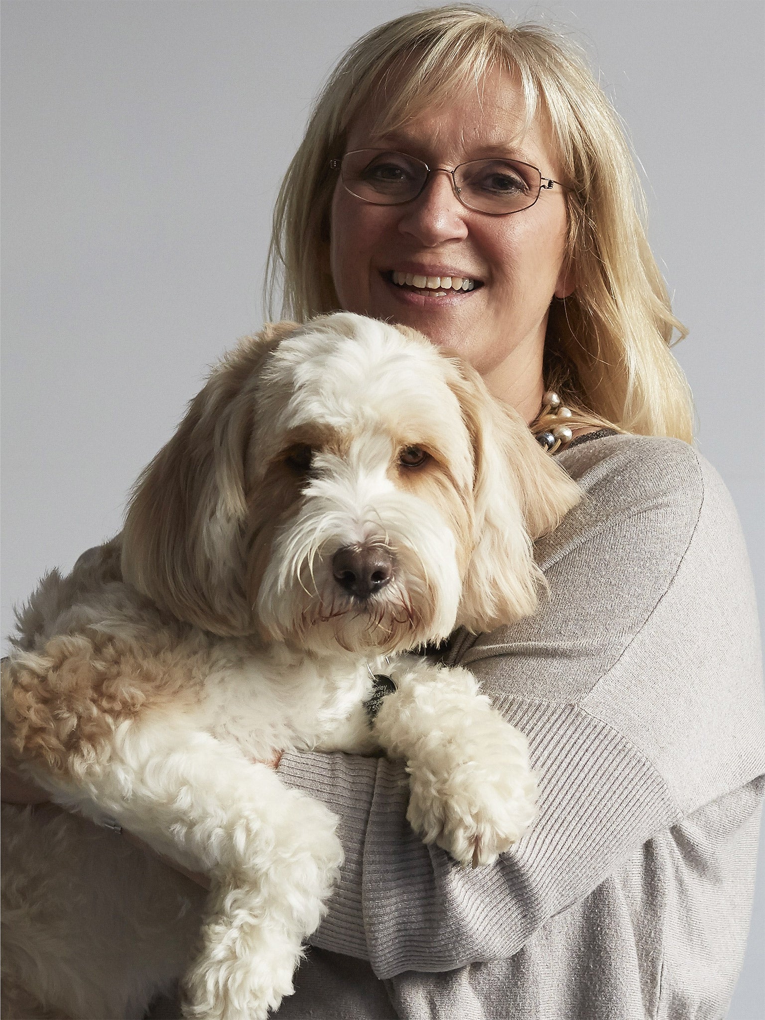 Making friends: Victoria with her Tibetan terrier, Rufus, who is probably better-known in the village than she is