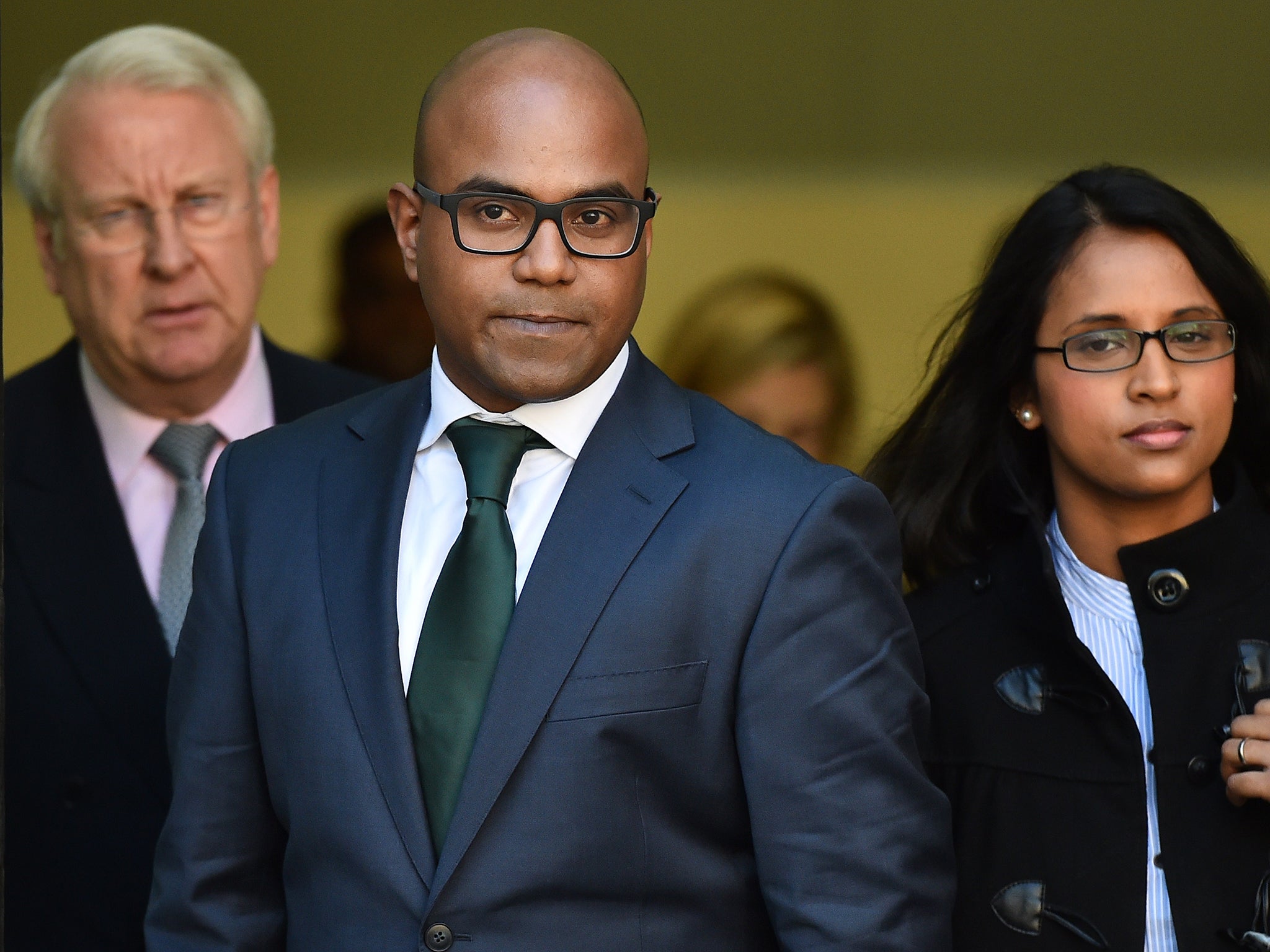 Dr Dhanuson Dharmasena, centre, has been cleared of performing FGM (Getty)
