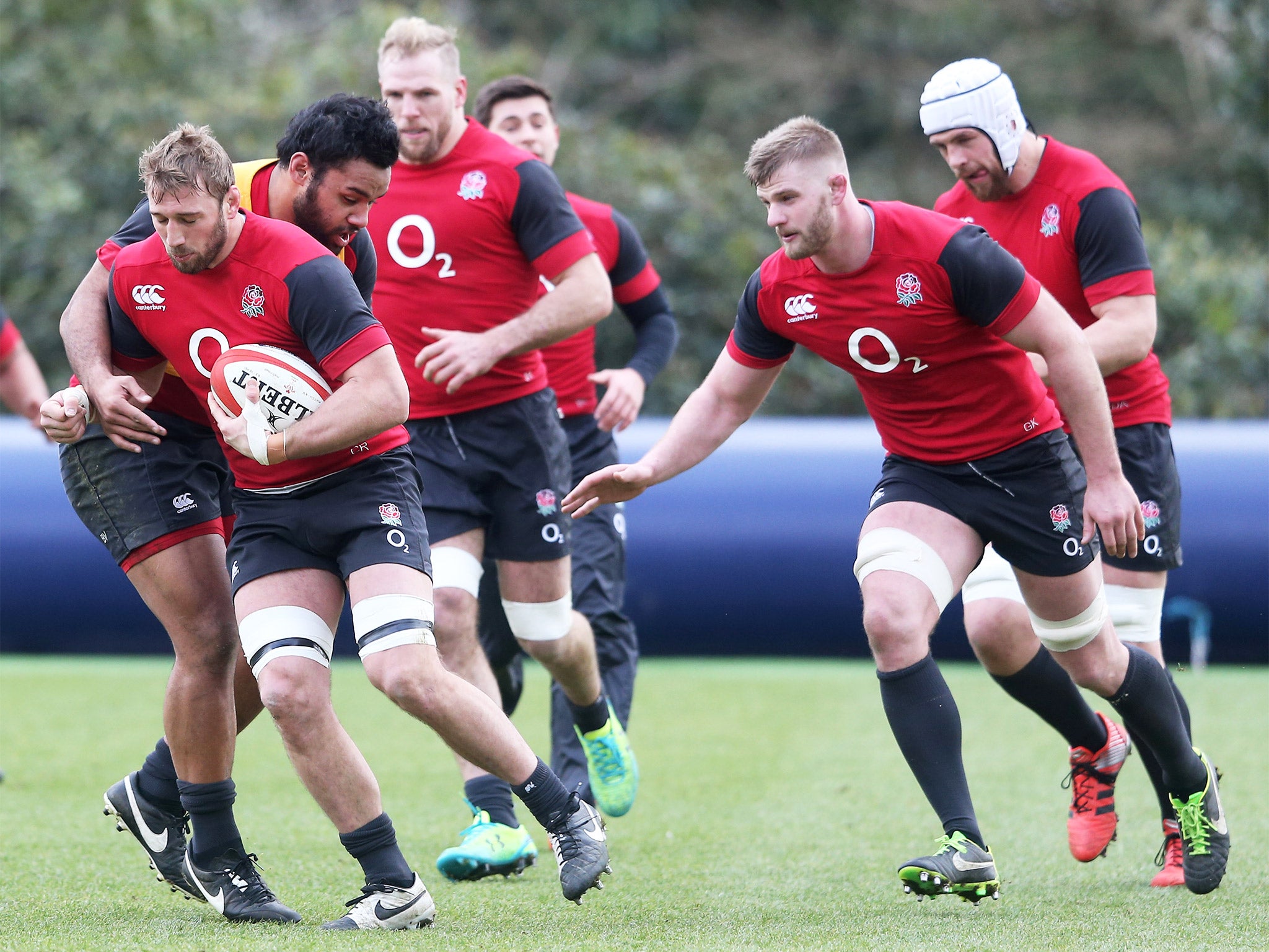 The England captain, Chris Robshaw, is tackled by Billy Vunipola during England training at Pennyhill Park