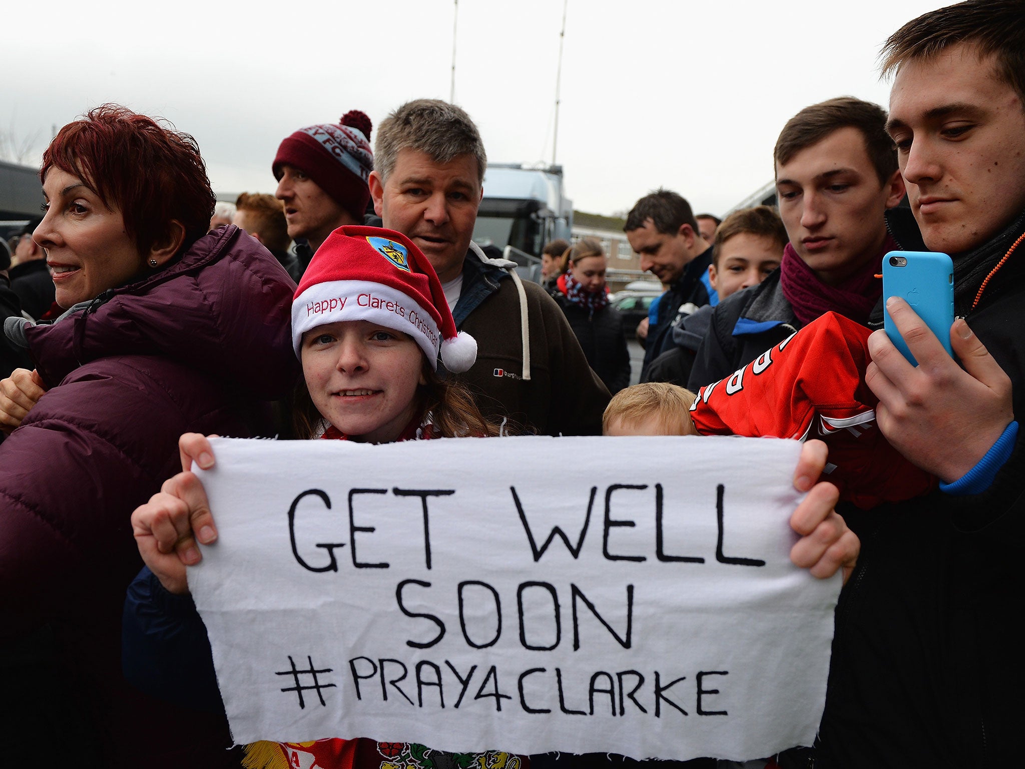 Fans at Burnley send their thoughts to Clarke Carlisle after he was hit by a lorry